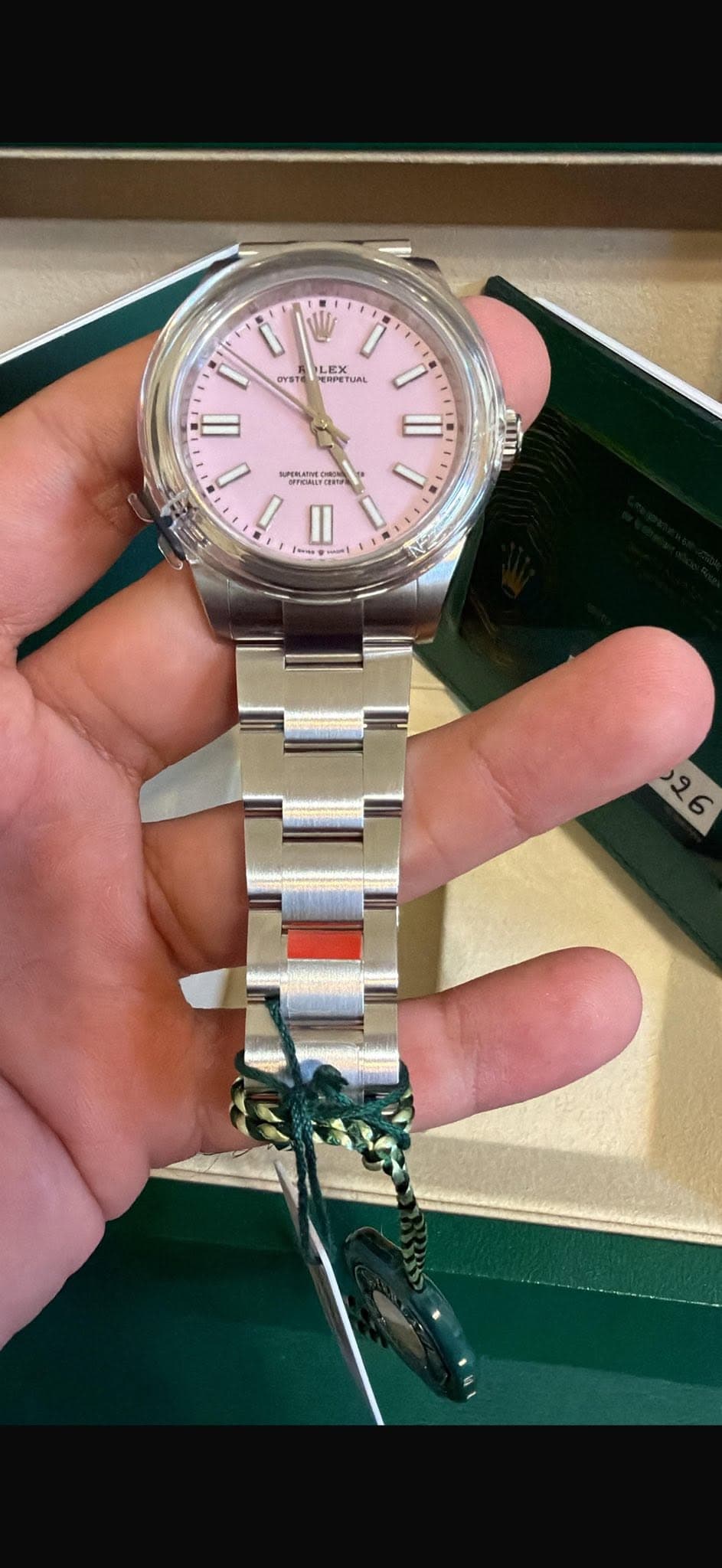 May be an image of wrist watch and text