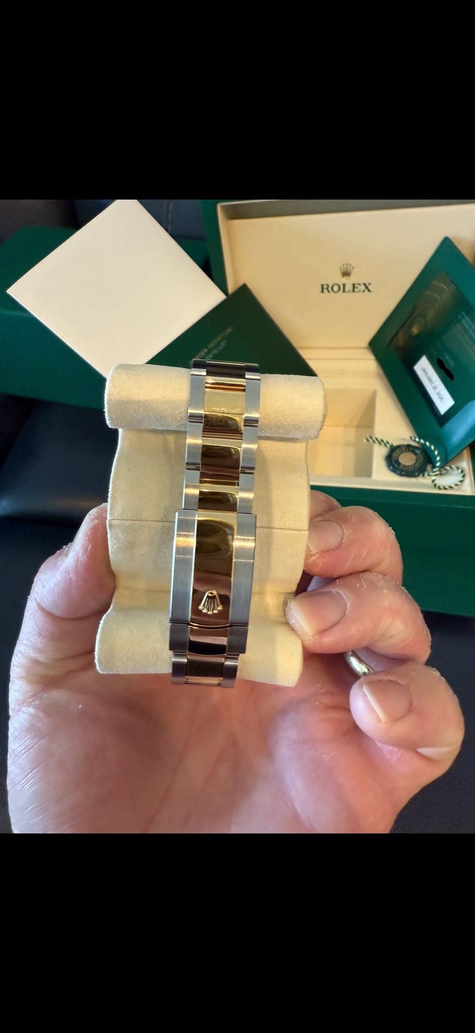 May be an image of napkin ring, wrist watch, fragrance and text that says 'ROLEX ROLEX'