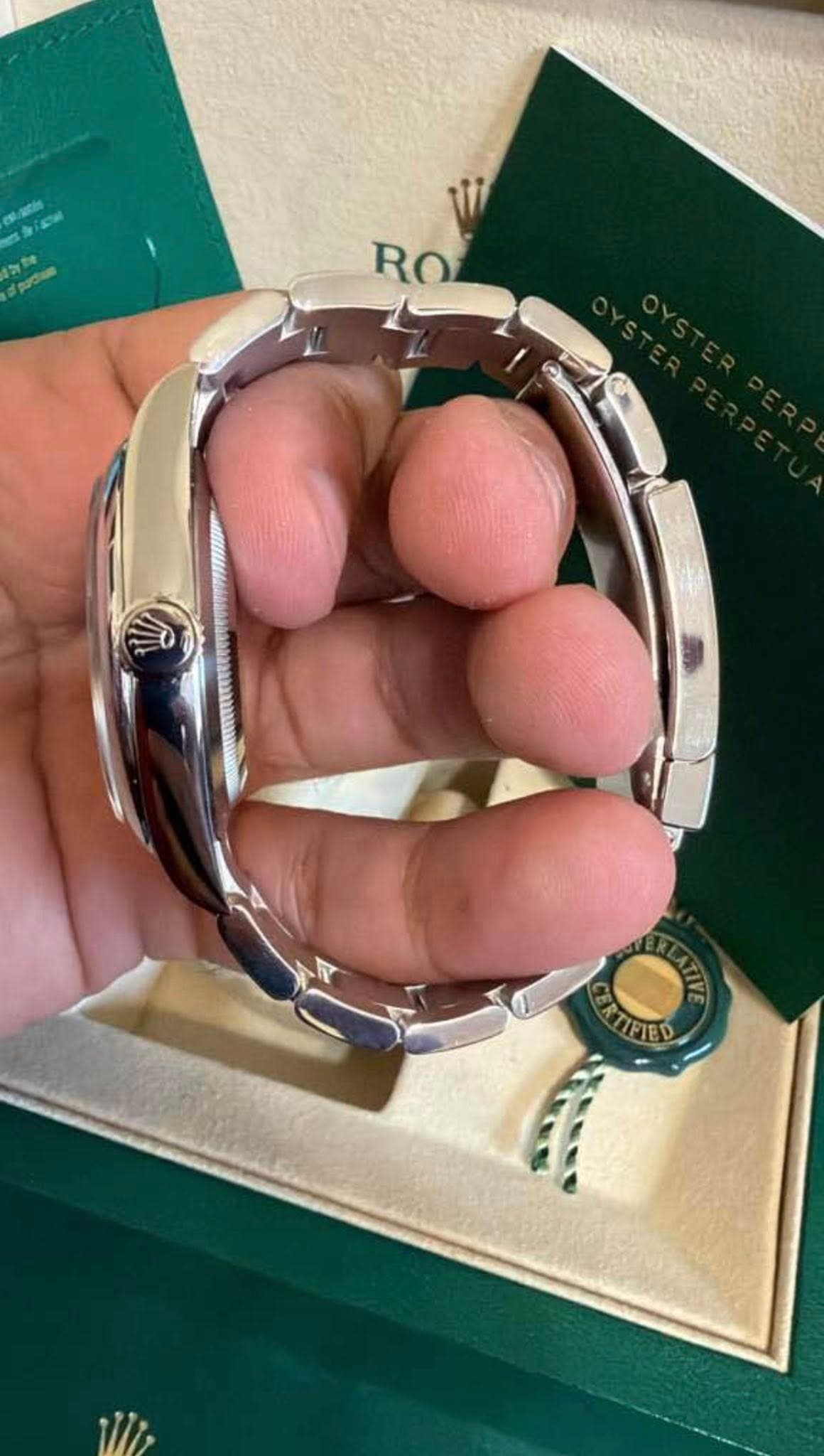 May be an image of wrist watch and text that says 'RO R RO CRIFIED TFIED'