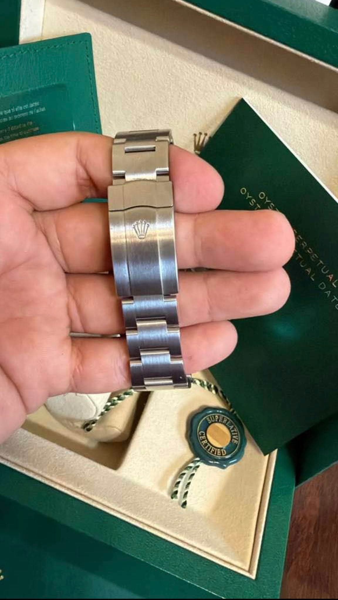 May be an image of wrist watch and text