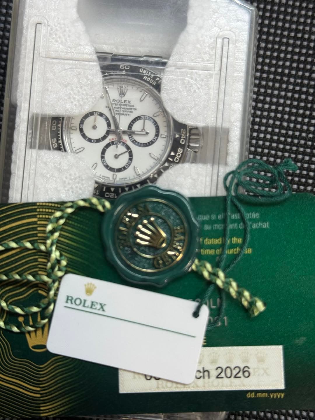 May be an image of wrist watch and text