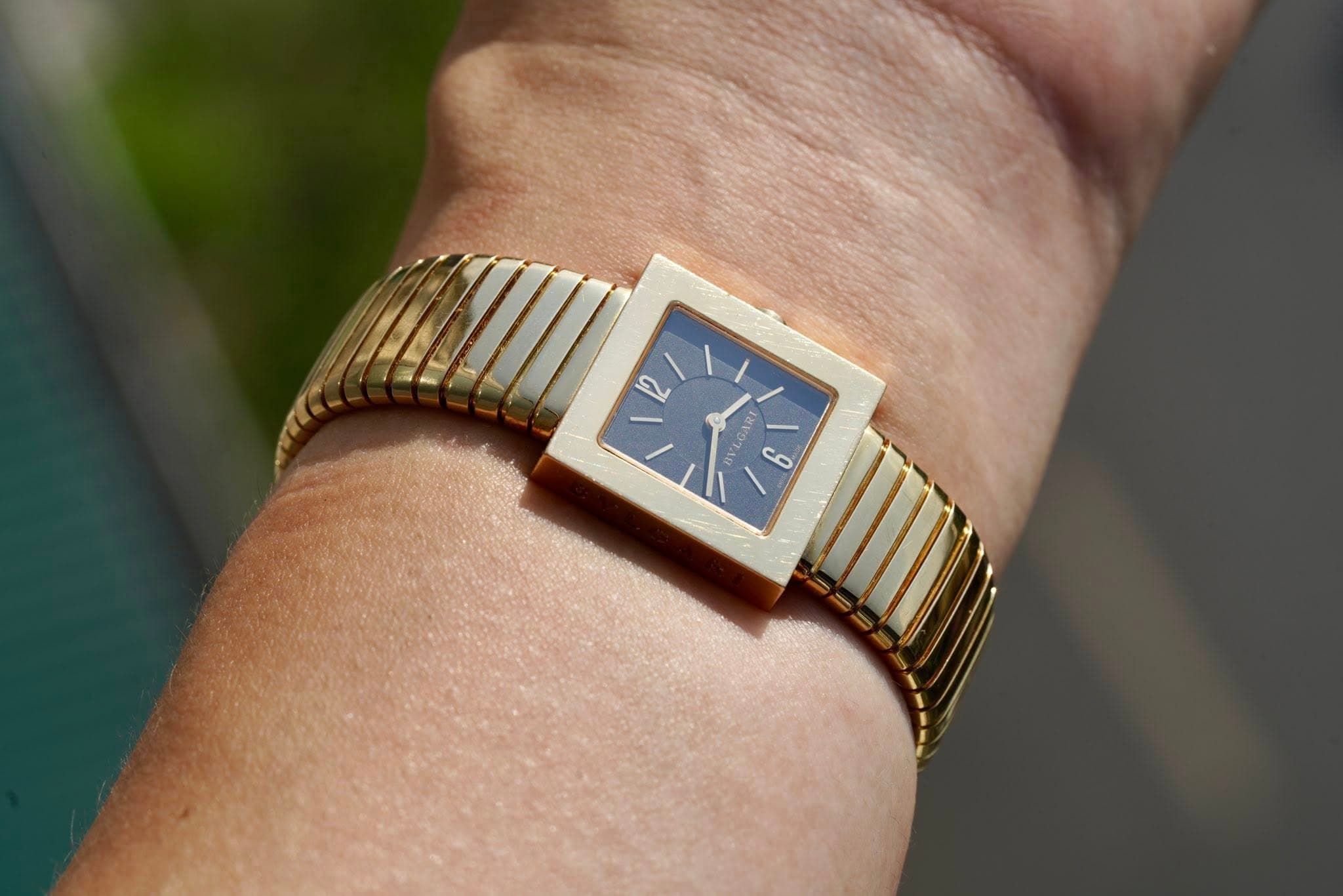 May be an image of jewelry, digital watch and text