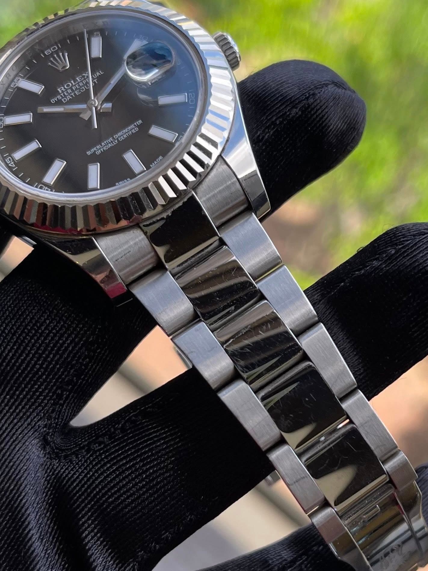May be an image of wrist watch and text