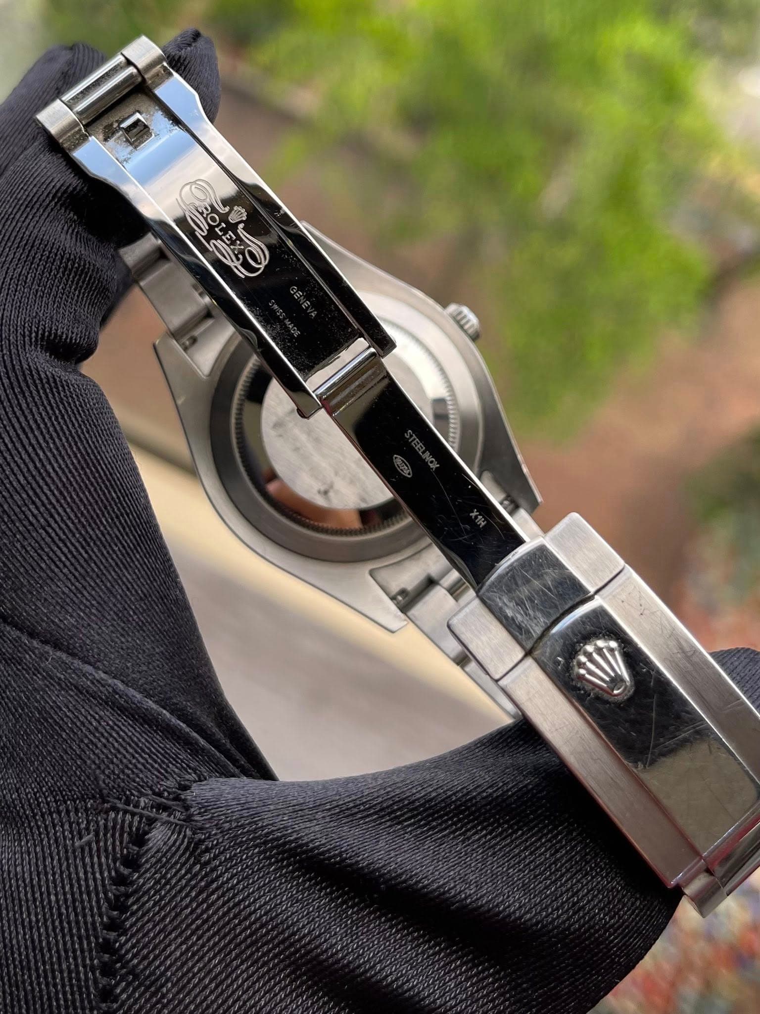 May be an image of wrist watch and text