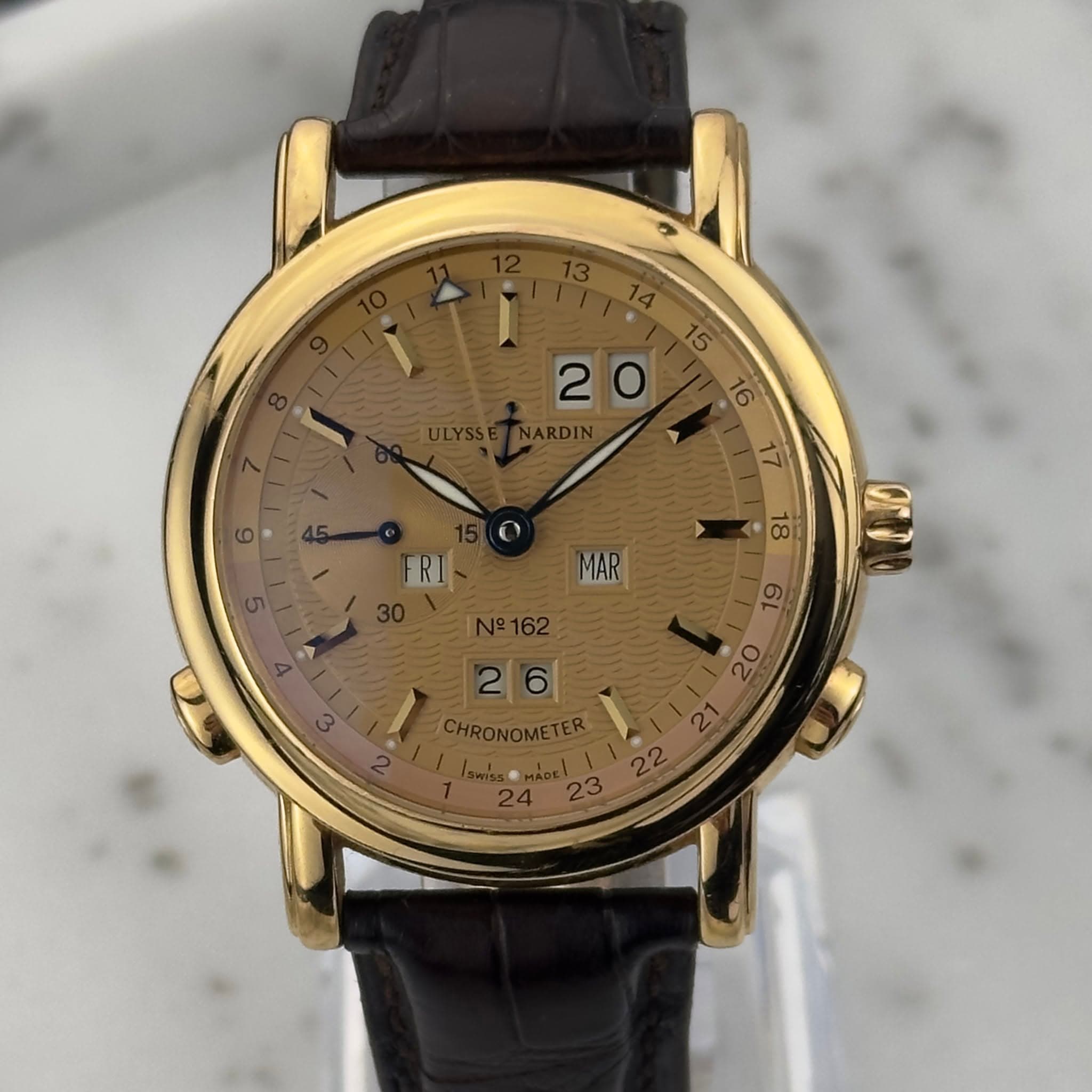May be an image of wrist watch and text that says ' MAR 18 00 6L 26 20 23'