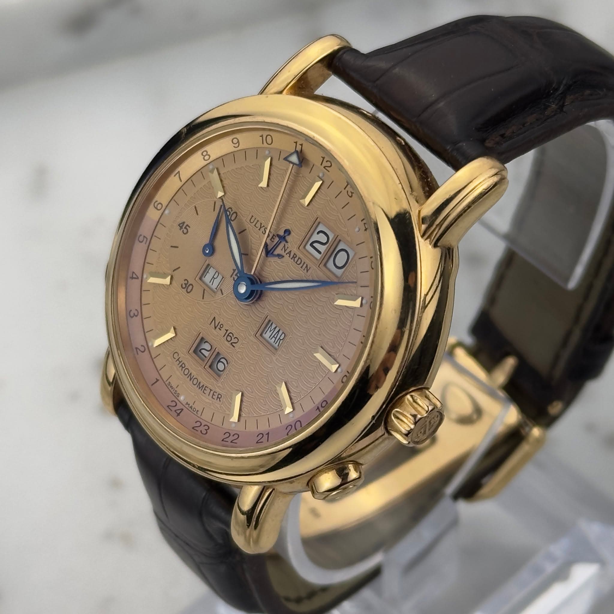 May be an image of wrist watch and text that says ' ١ ULYS 4 30 ARDIA 20 2 3 MAK No 162 ۲ر semioel CHRONOMETER 2 If 23 22 1'