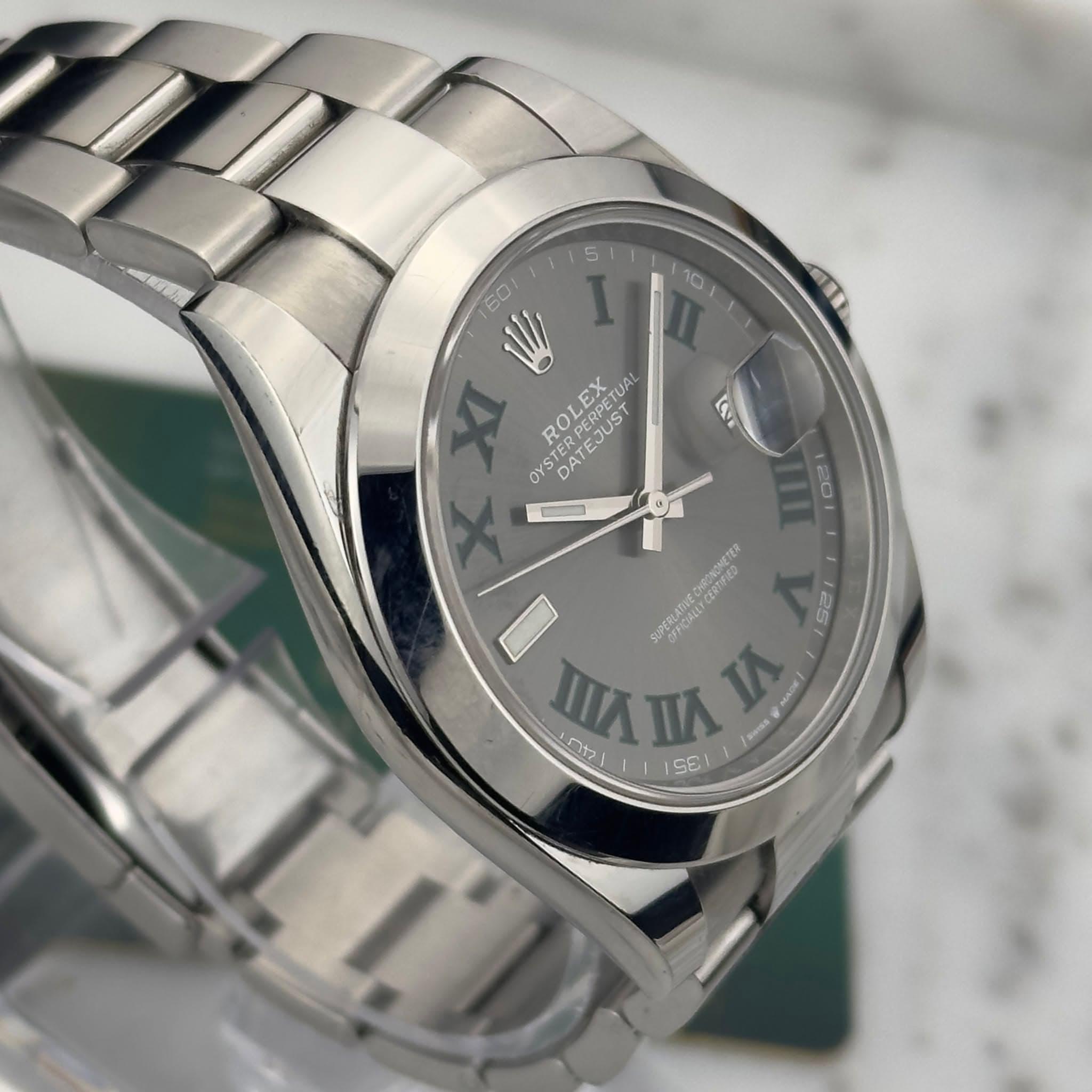 May be an image of wrist watch and text