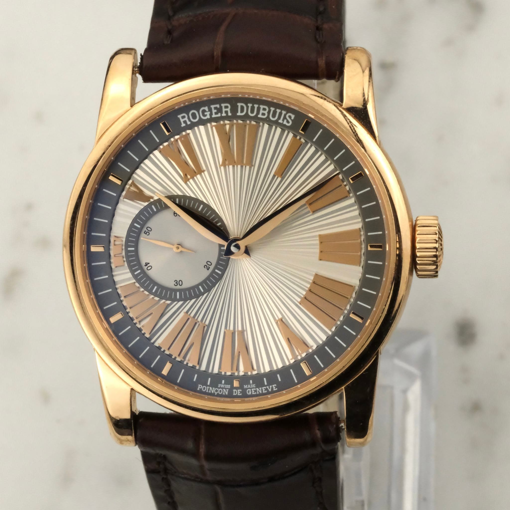 May be an image of wrist watch and text that says 'ROGER ROGER DUBUIS 1I1 ၅ 50 50 ي 40 20 30 NÇON POINÇON GENEVE IETEVE'