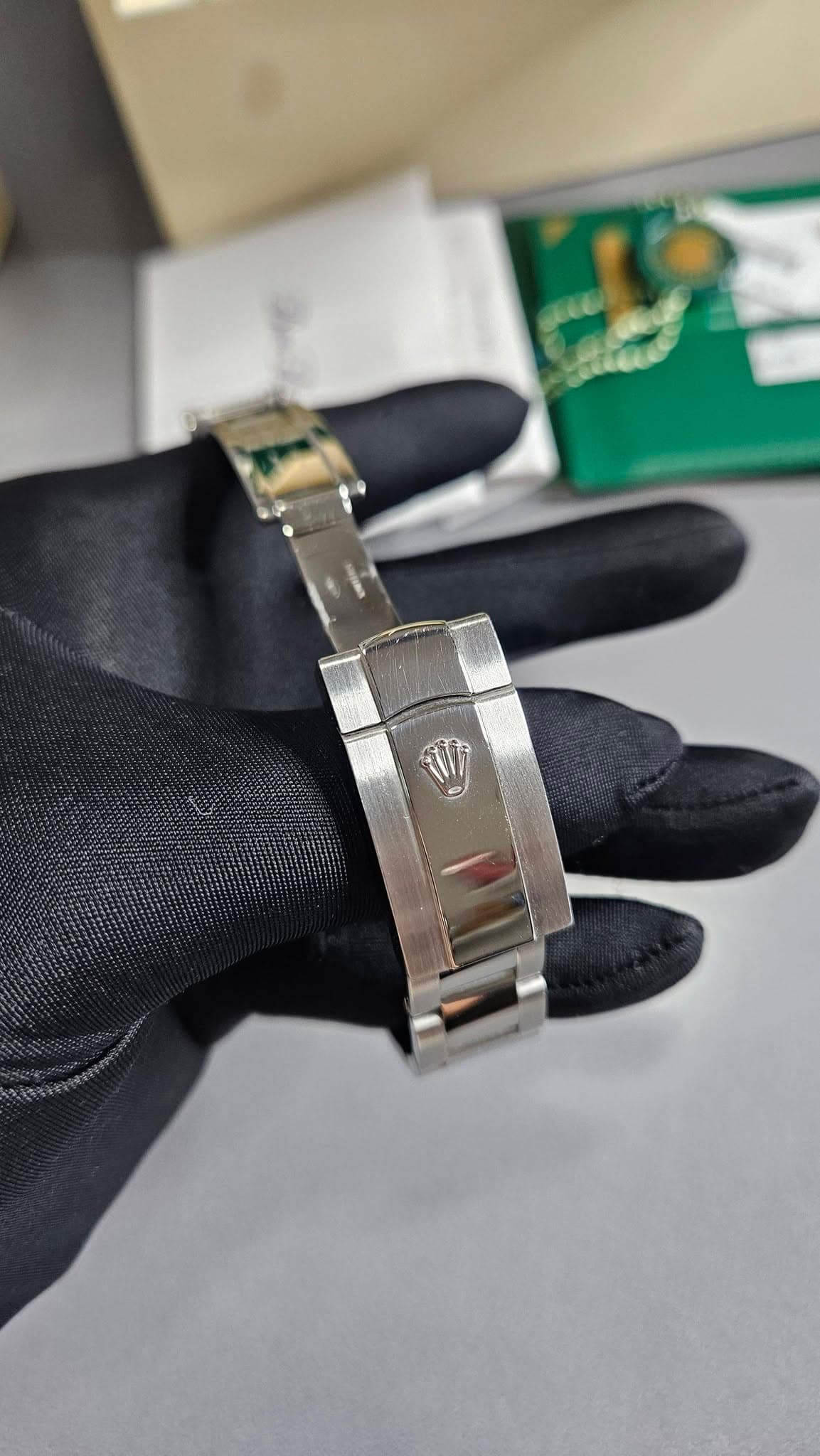 May be an image of wrist watch, ring and text