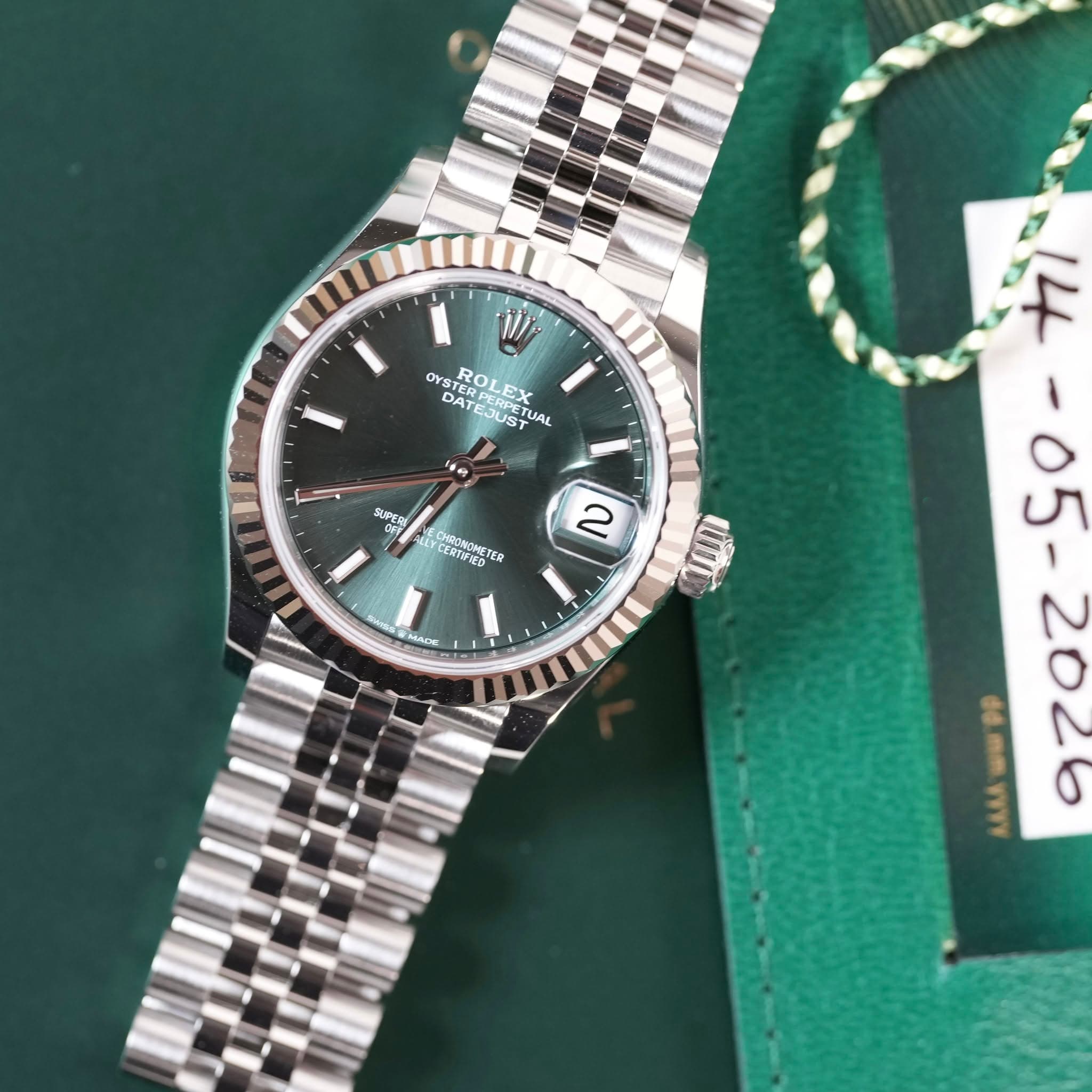 May be an image of wrist watch and text