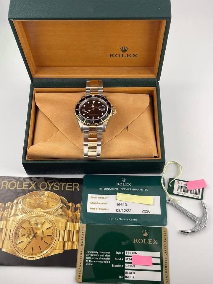 May be an image of wrist watch and text that says 'ROLEX + E 20 0S 12 ROLEX OYSTER ROLEX INTERNATIONAL WNTERNUATIONALSERNICE.GUAMANTE SERVICE GUARANTEE Serlal number: Model mumber:…