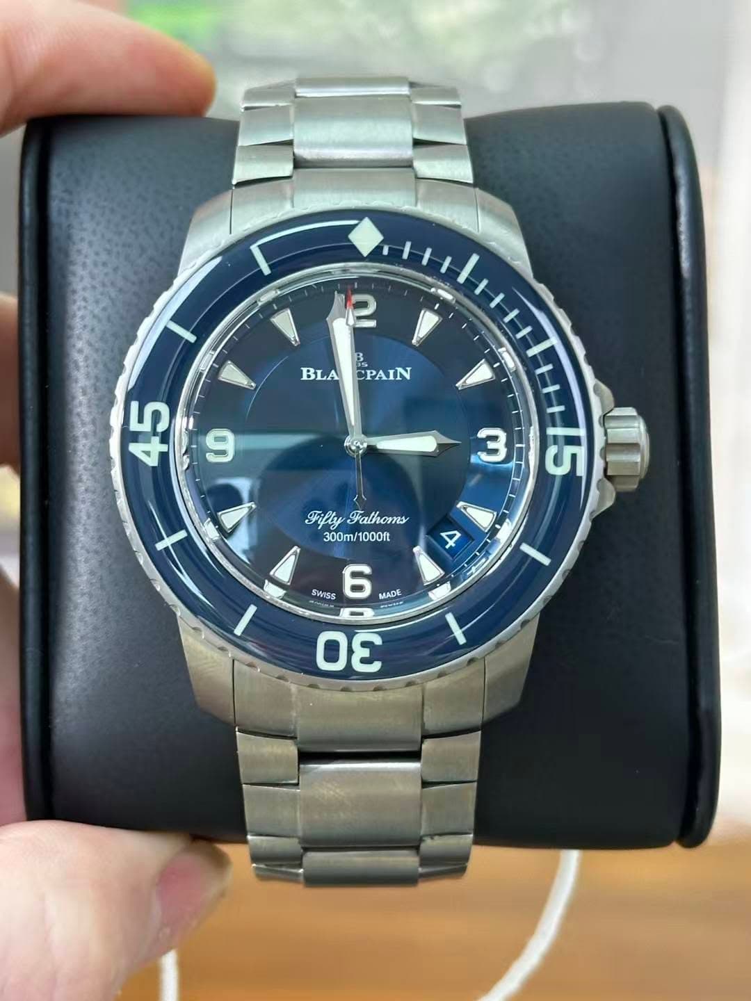 May be an image of digital watch and text that says '2 BLA BLACPAIN CPAIN 45 CO FiflyFathoms Fifly Fathoms 300m/1000ft 300m 1000ft 3 iTH+5 CI 4 SWISS 6 MADE m'