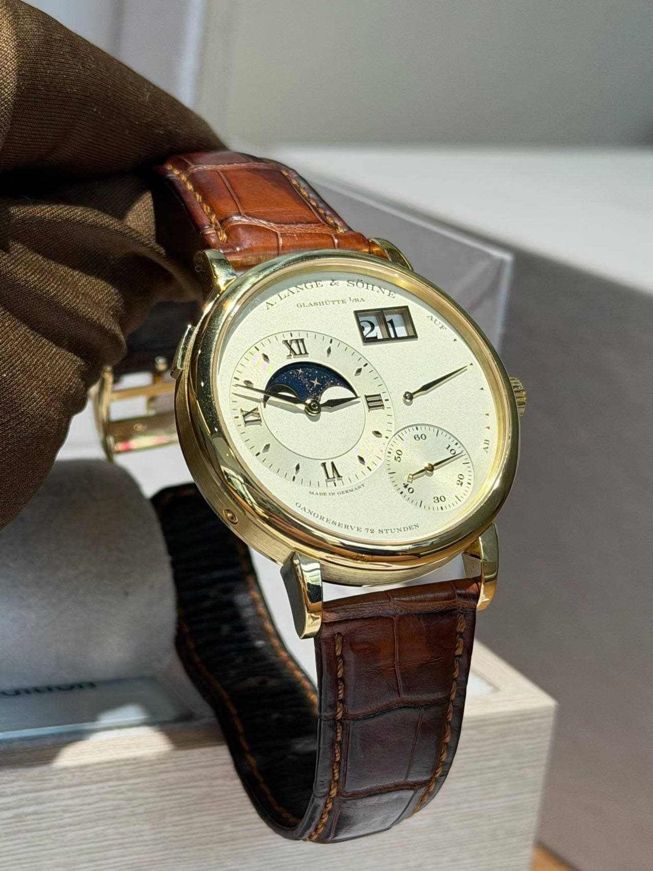 May be an image of wrist watch and text