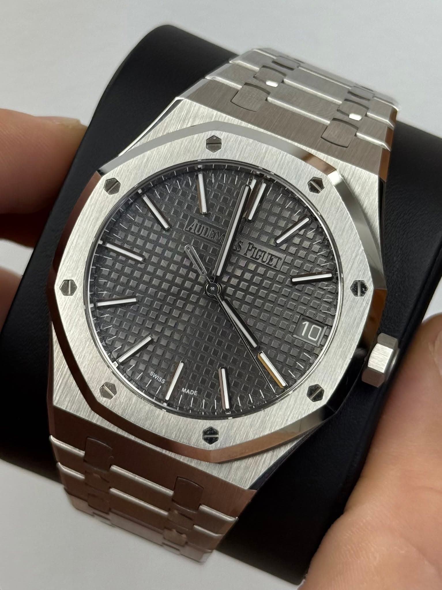 May be an image of wrist watch and text