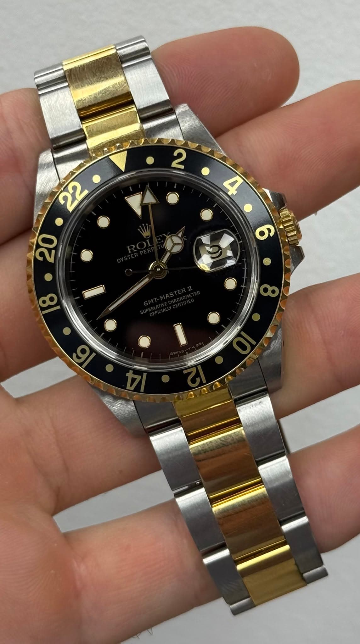 May be an image of wrist watch and text