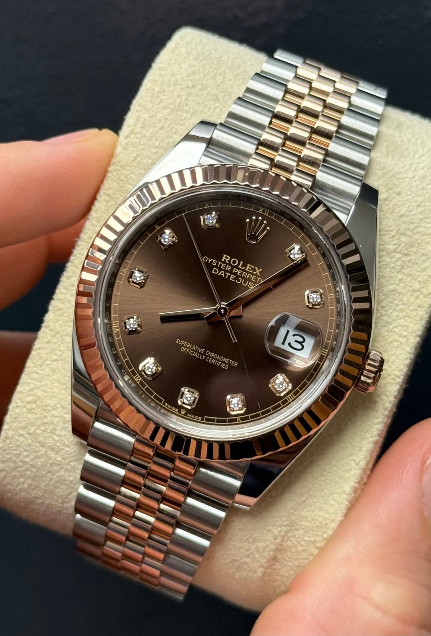 May be an image of wrist watch and text