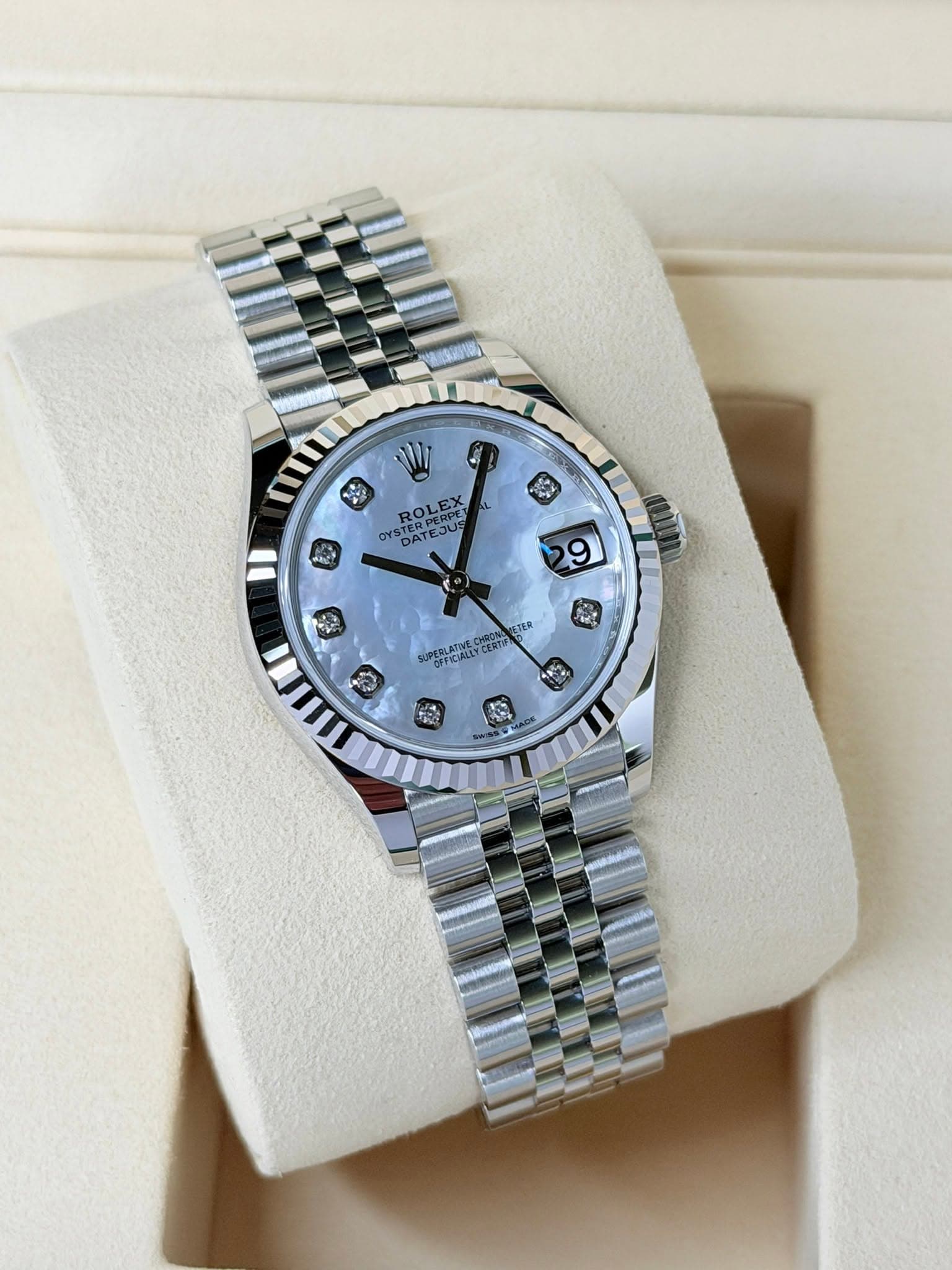 May be an image of wrist watch and text