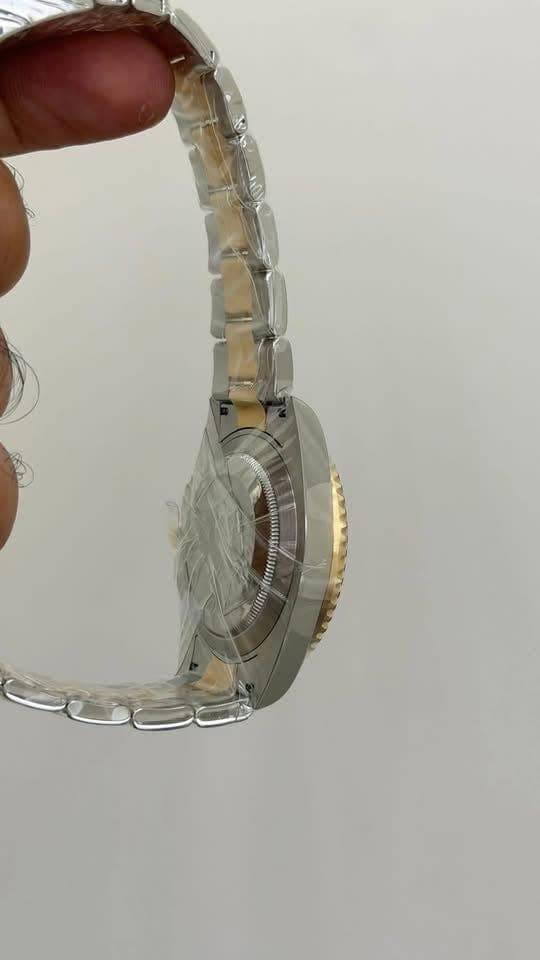 May be an image of wrist watch and jewelry