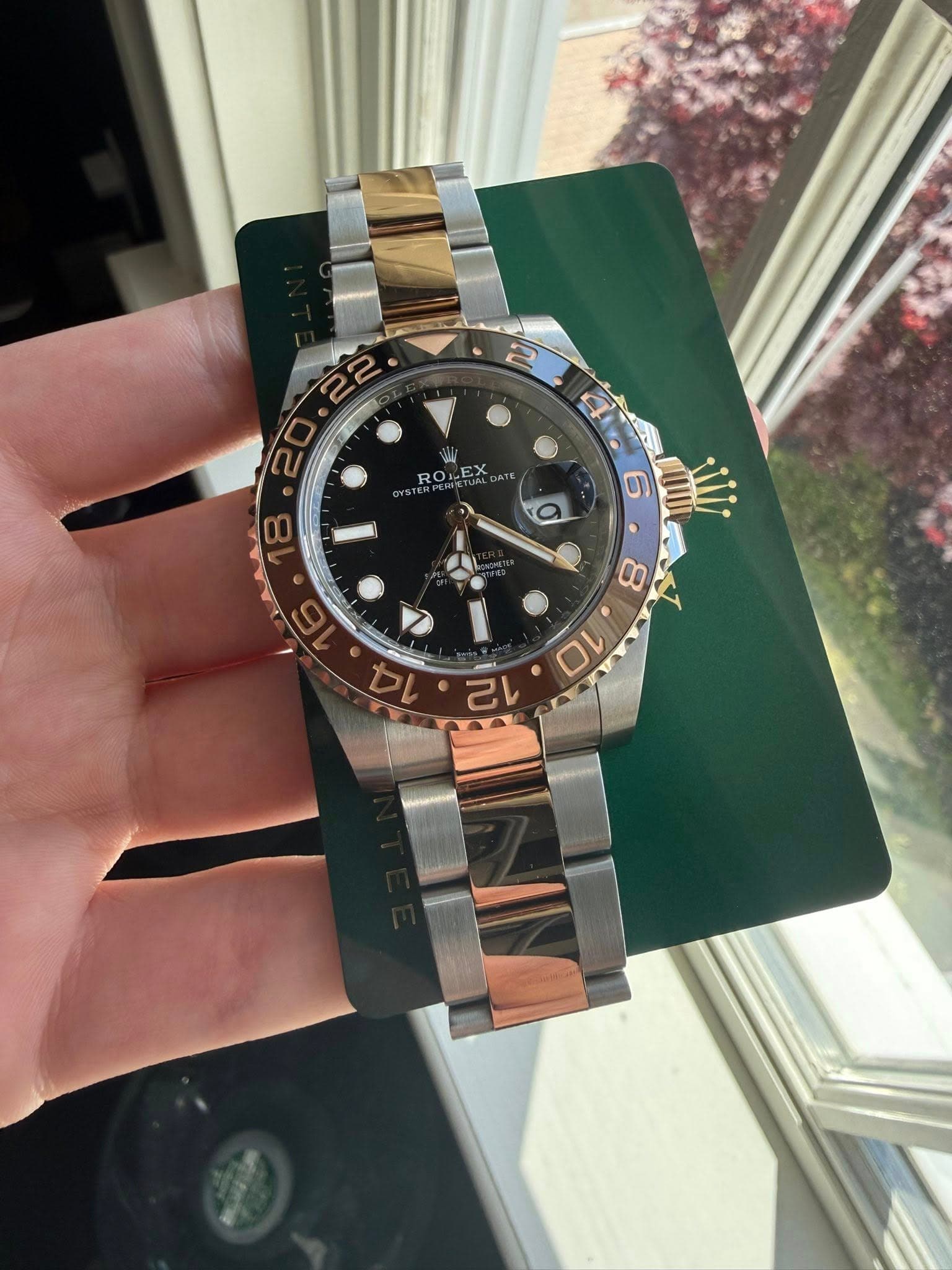 May be an image of wrist watch and text