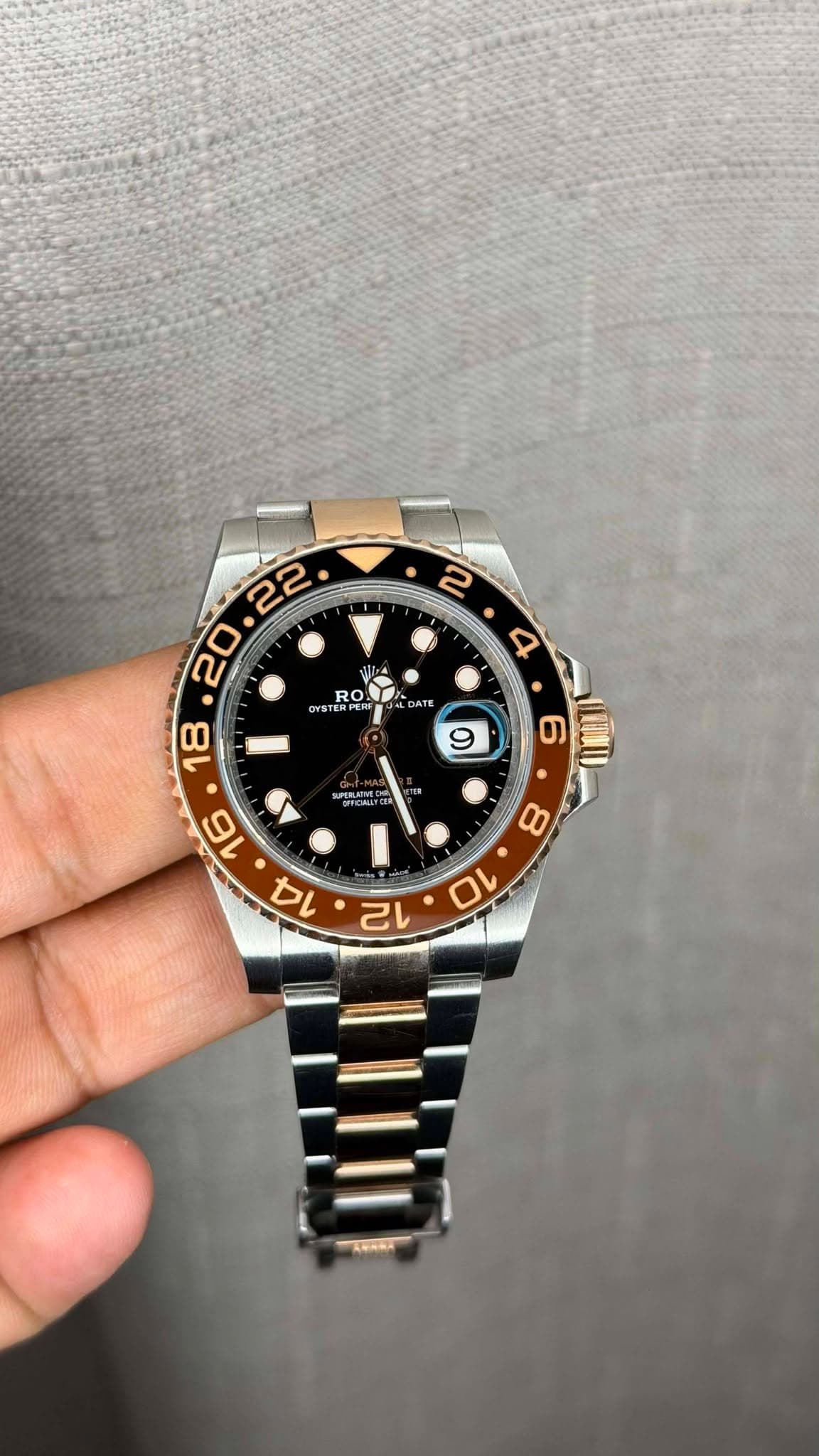 May be an image of wrist watch and text