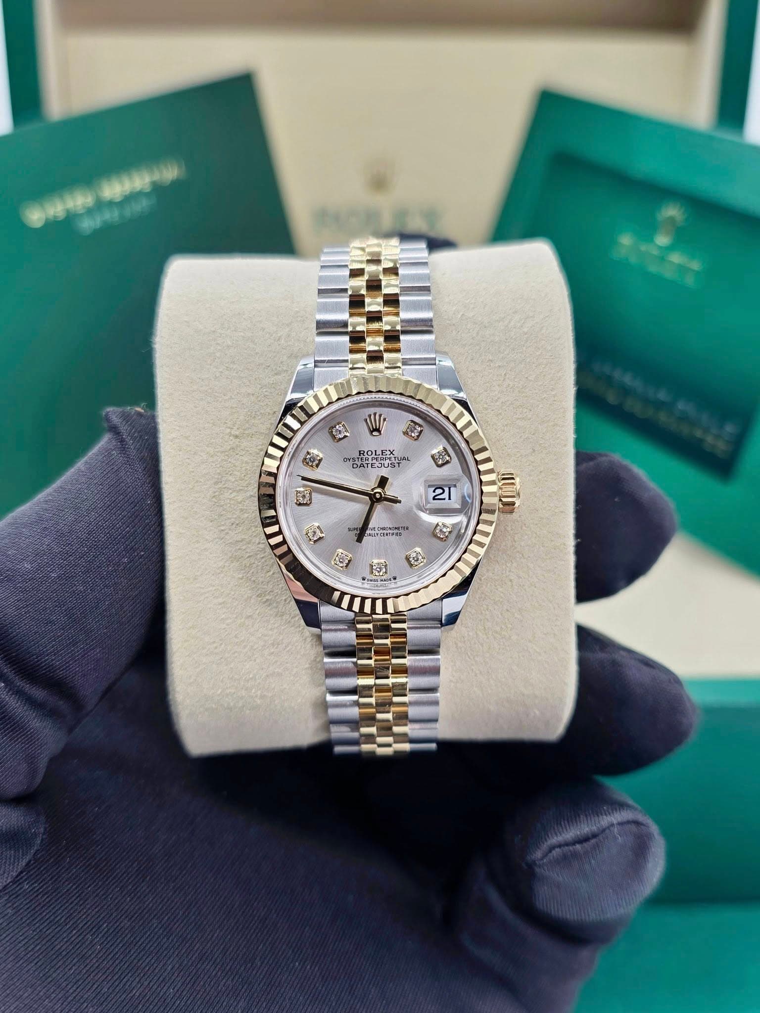 May be an image of wrist watch and text