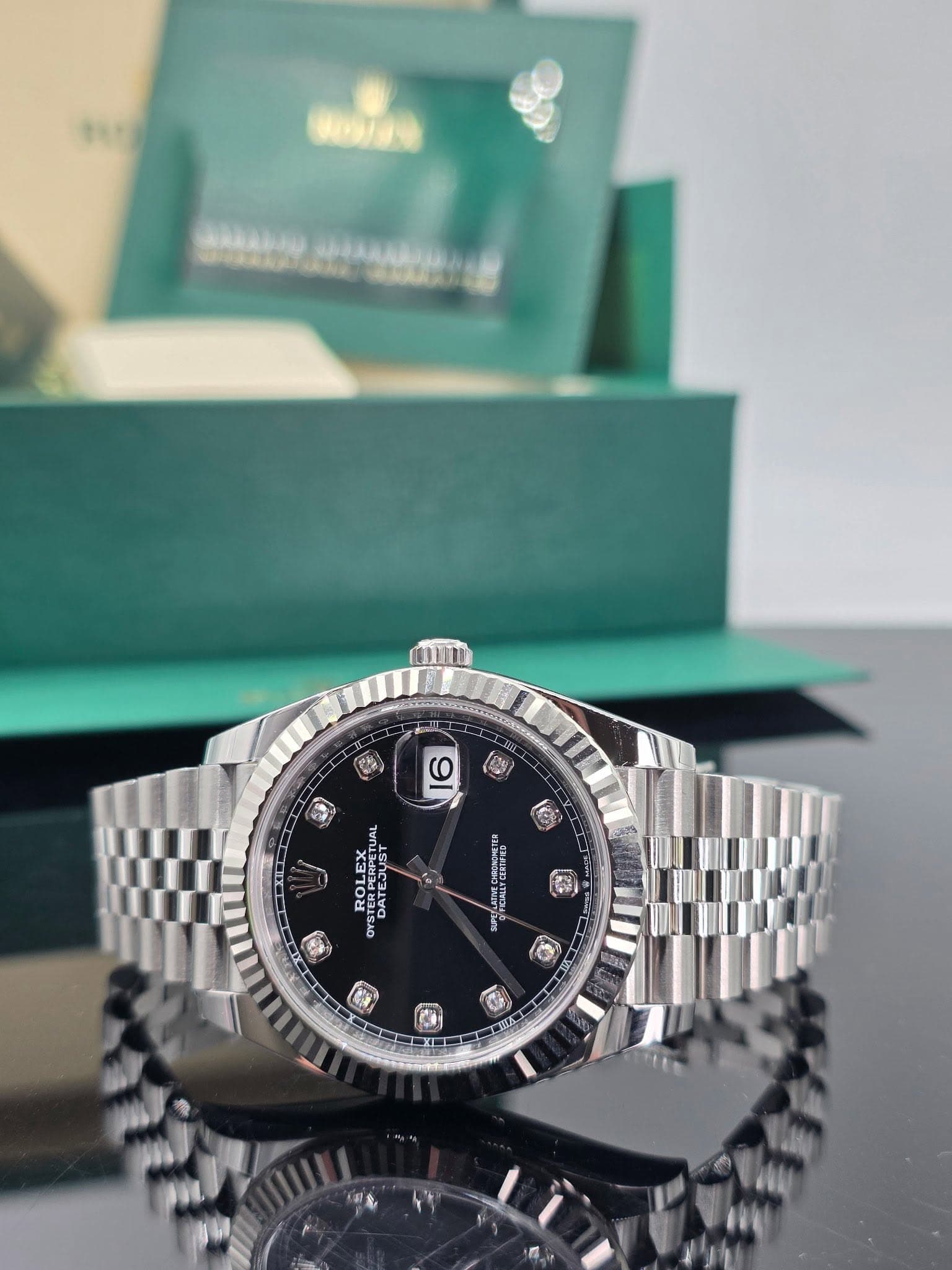 May be an image of wrist watch and text