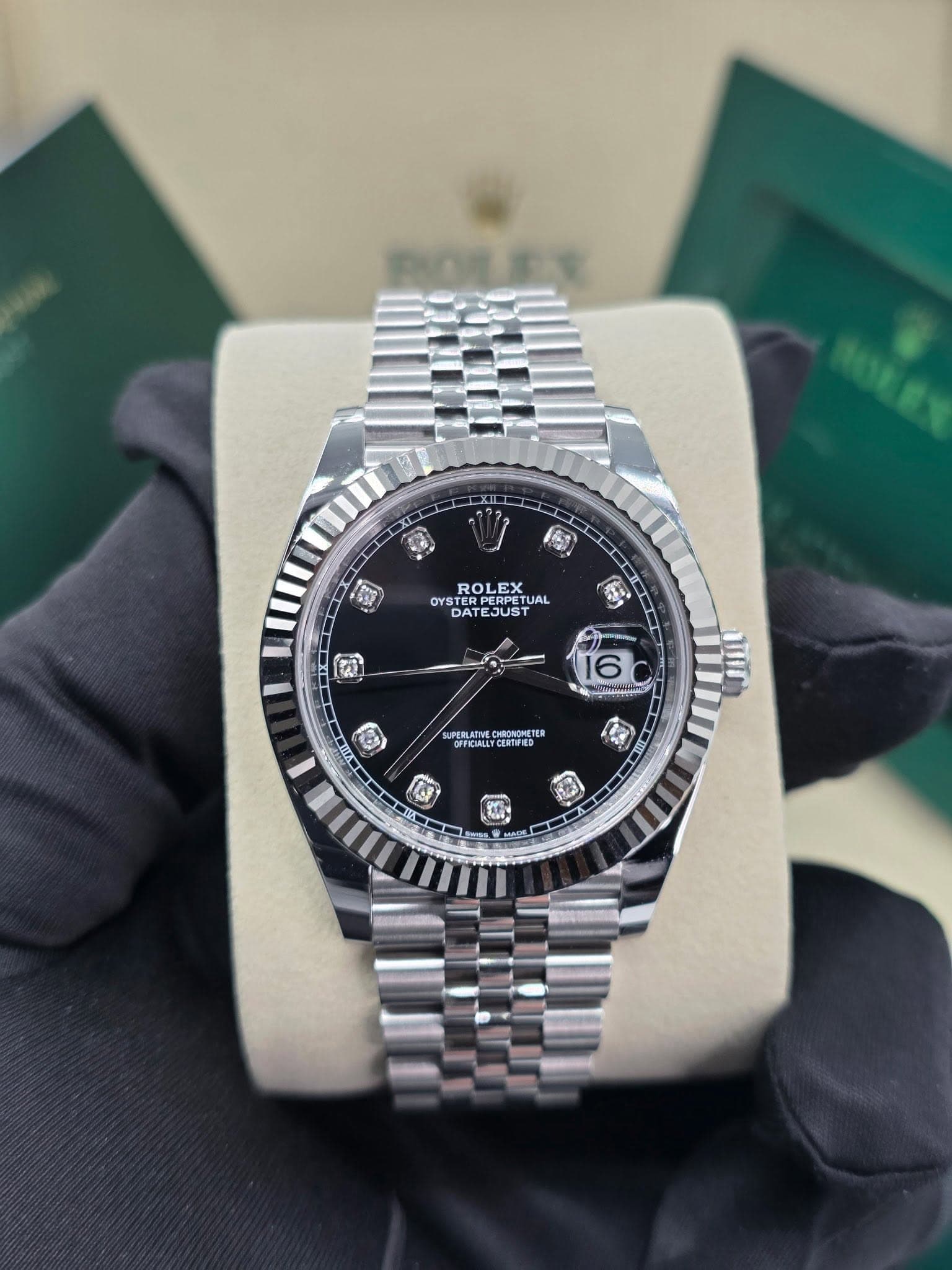 May be an image of wrist watch and text