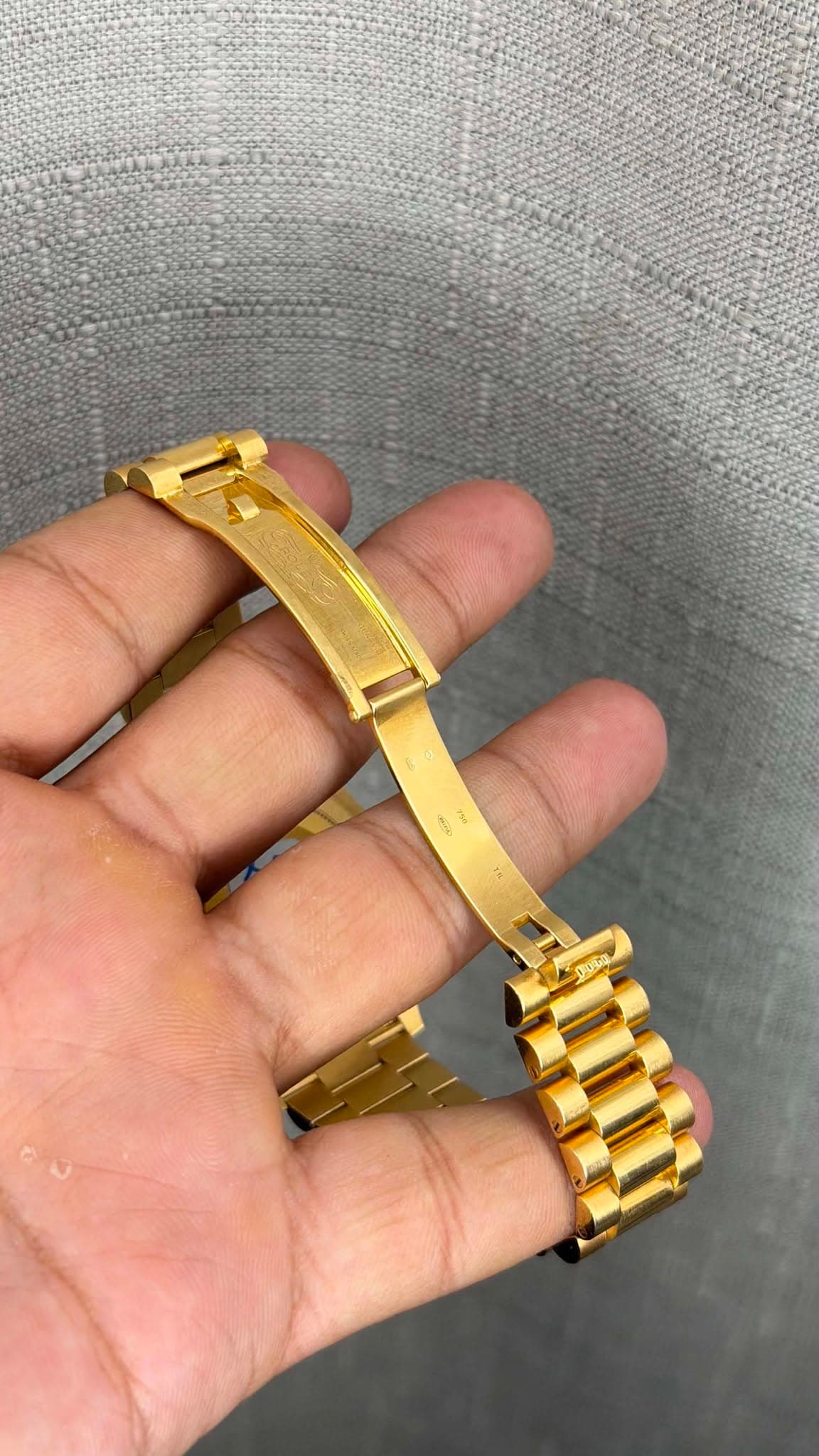 May be an image of jewelry, wrist watch and text