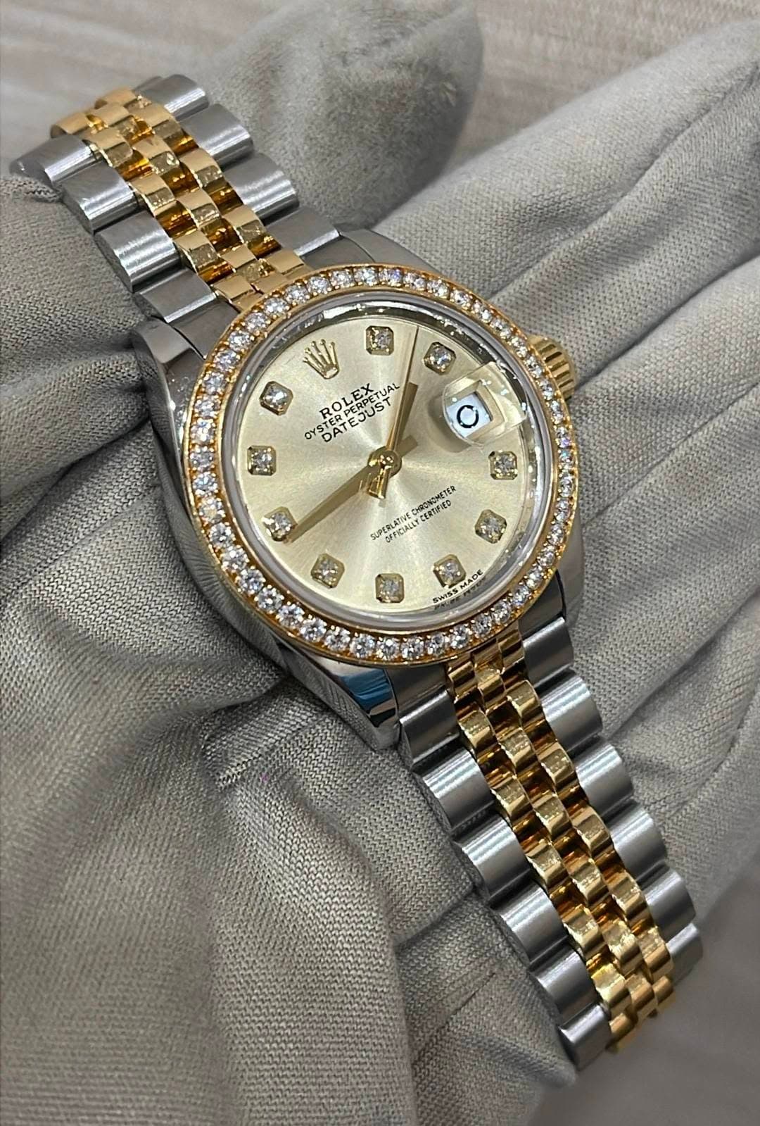 May be an image of wrist watch and text