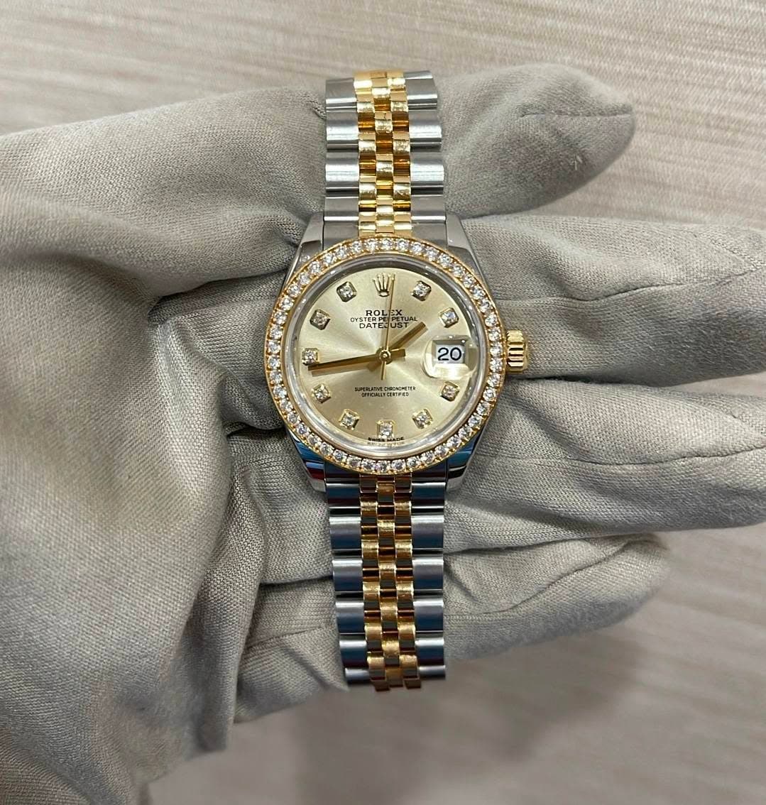 May be an image of wrist watch and text