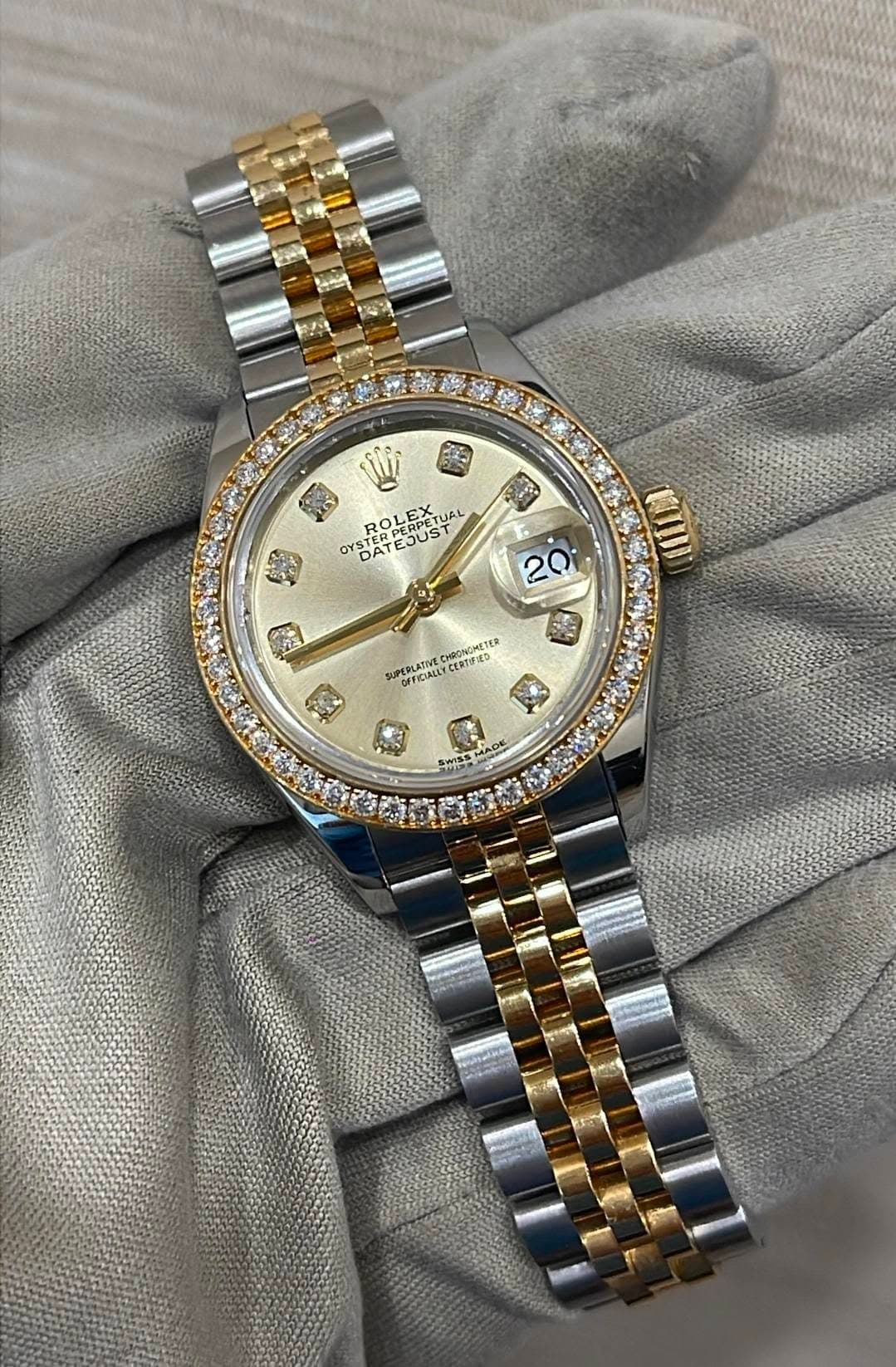 May be an image of wrist watch and text
