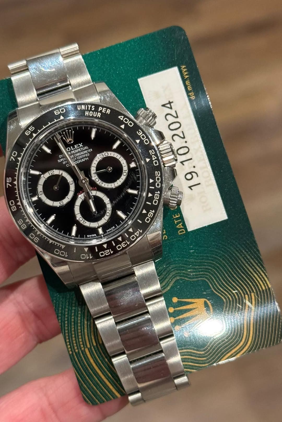 May be an image of wrist watch and text