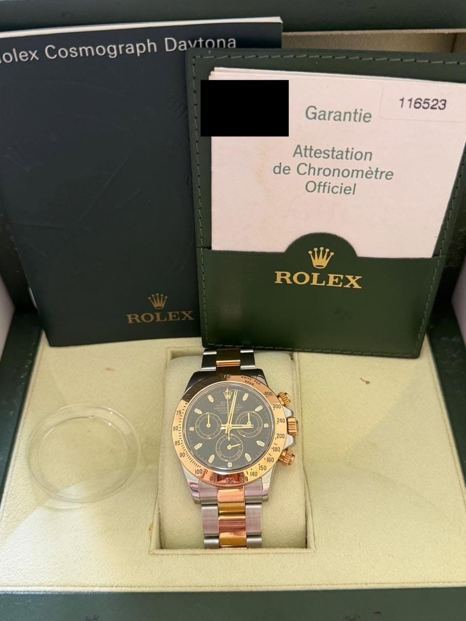 May be an image of wrist watch and text that says 'olex Cosmograph CosmographDavin Davtona Garantie 116523 Attestation de Chronomètre Officiel W ROLEX B50 L เย็่ย O 250 HTE 200 200…