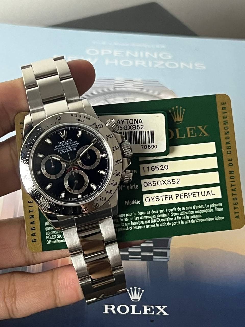 May be an image of wrist watch and text that says 'OPENING HORIZONS HOUR® 400 Ii AYTONA 5GX852 ROL 75 B590 6520 יצשוב 085GX852 dele OYSTER PERPETUAL pou ROA garan adjoncuur…