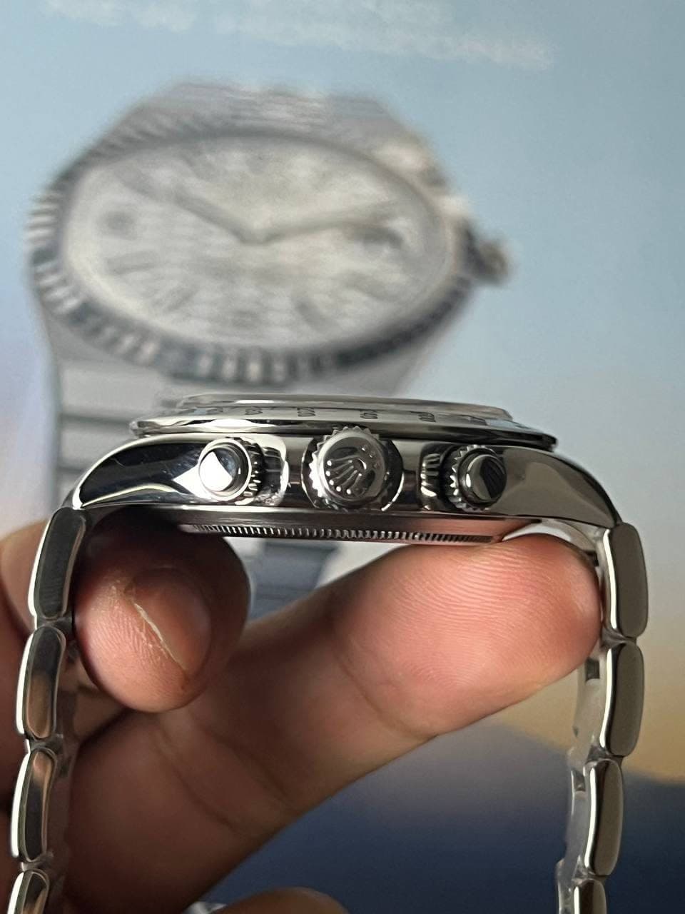 May be an image of wrist watch and text