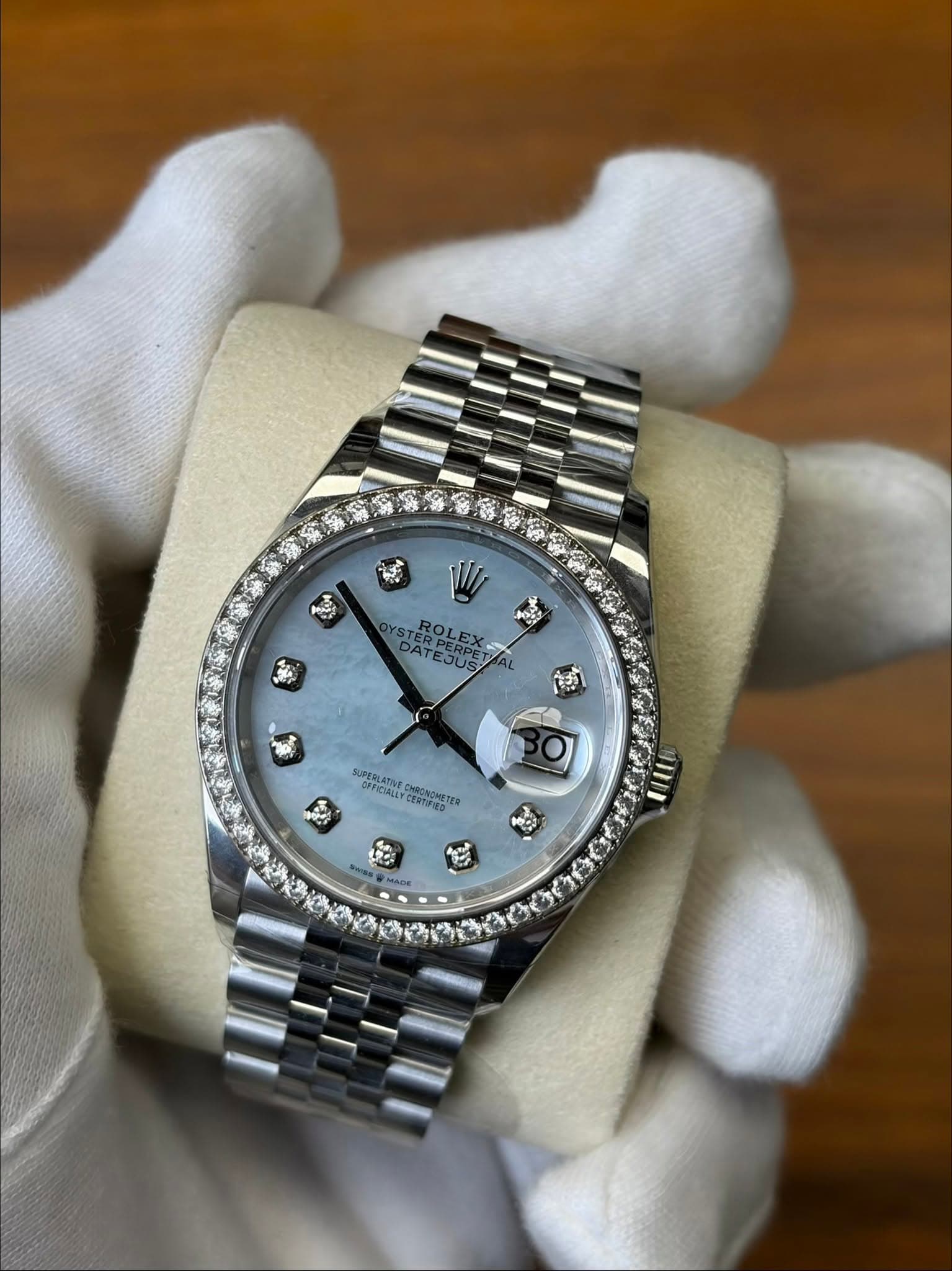 May be an image of wrist watch and text