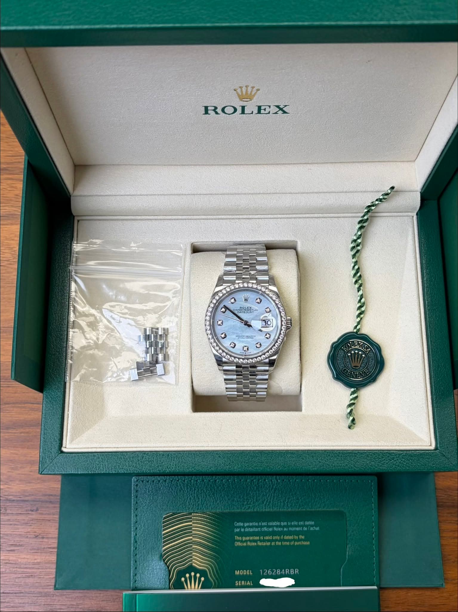 May be an image of wrist watch and text