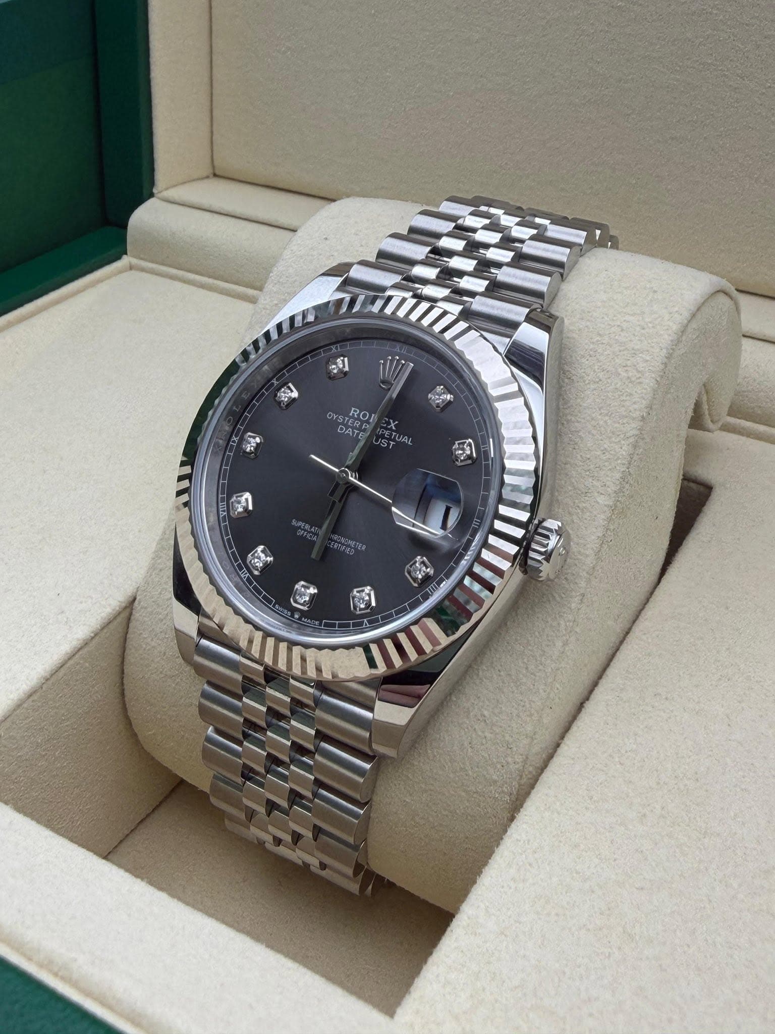 May be an image of wrist watch and text