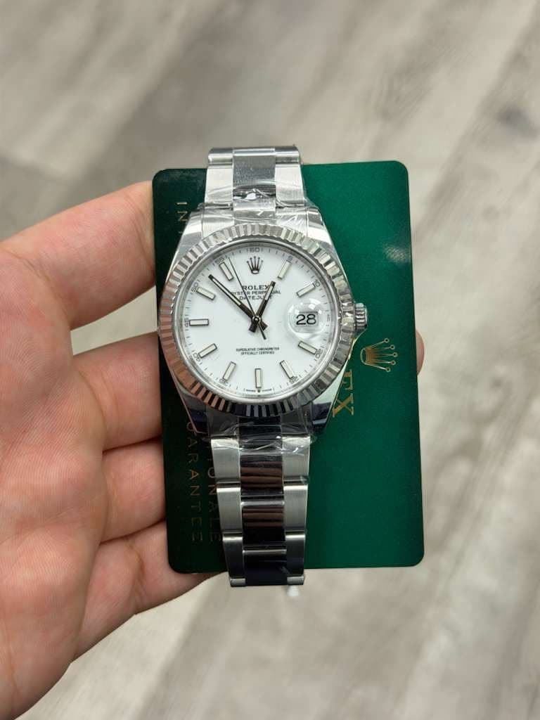 May be an image of wrist watch and text