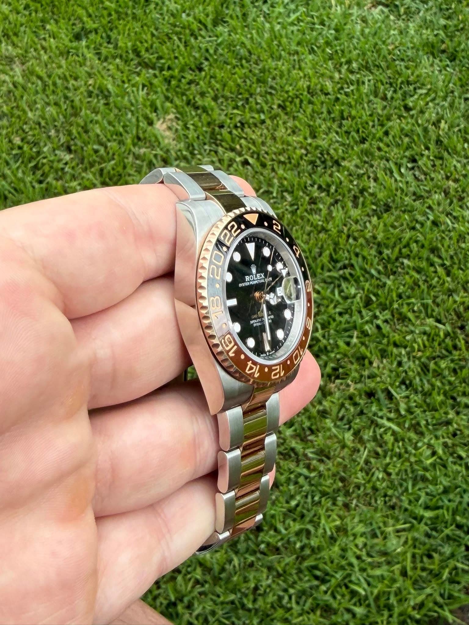 May be an image of wrist watch and text