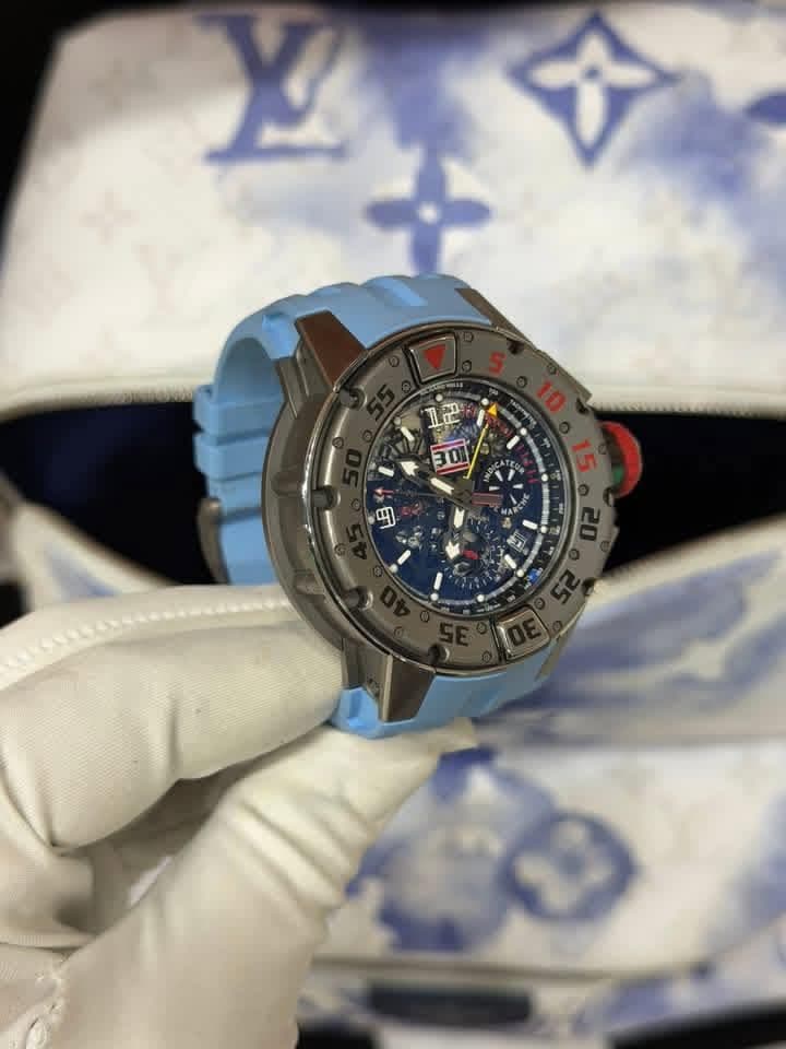 May be an image of wrist watch and text