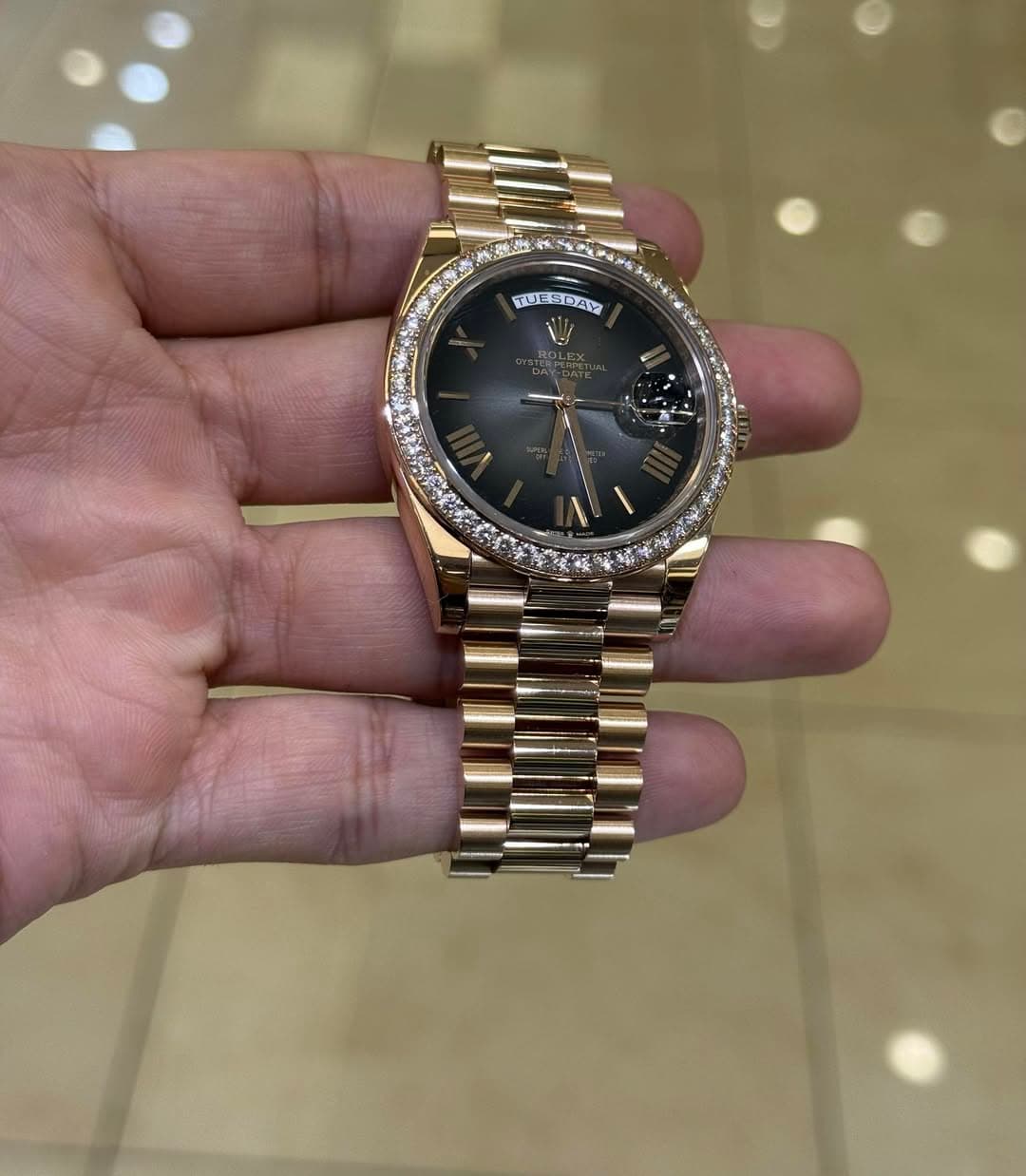 May be an image of wrist watch and text