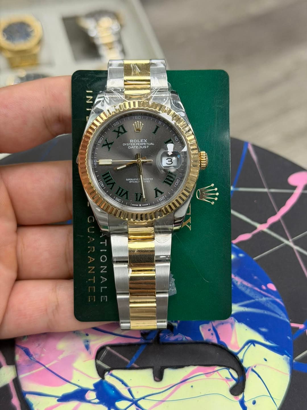 May be an image of wrist watch and text