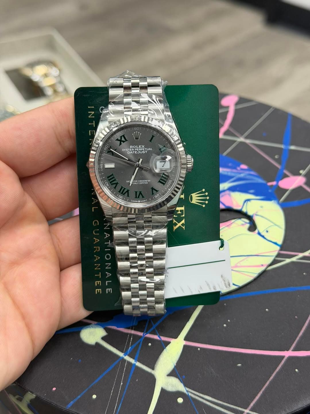 May be an image of wrist watch and text