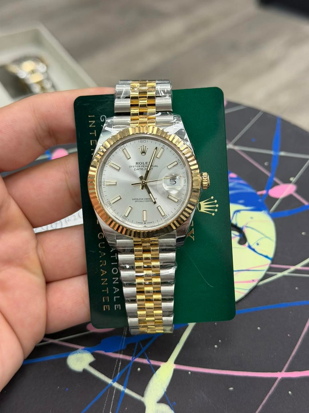 May be an image of wrist watch and text