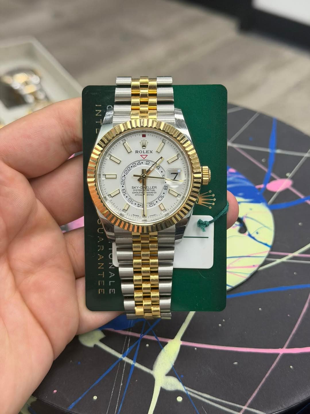 May be an image of wrist watch and text