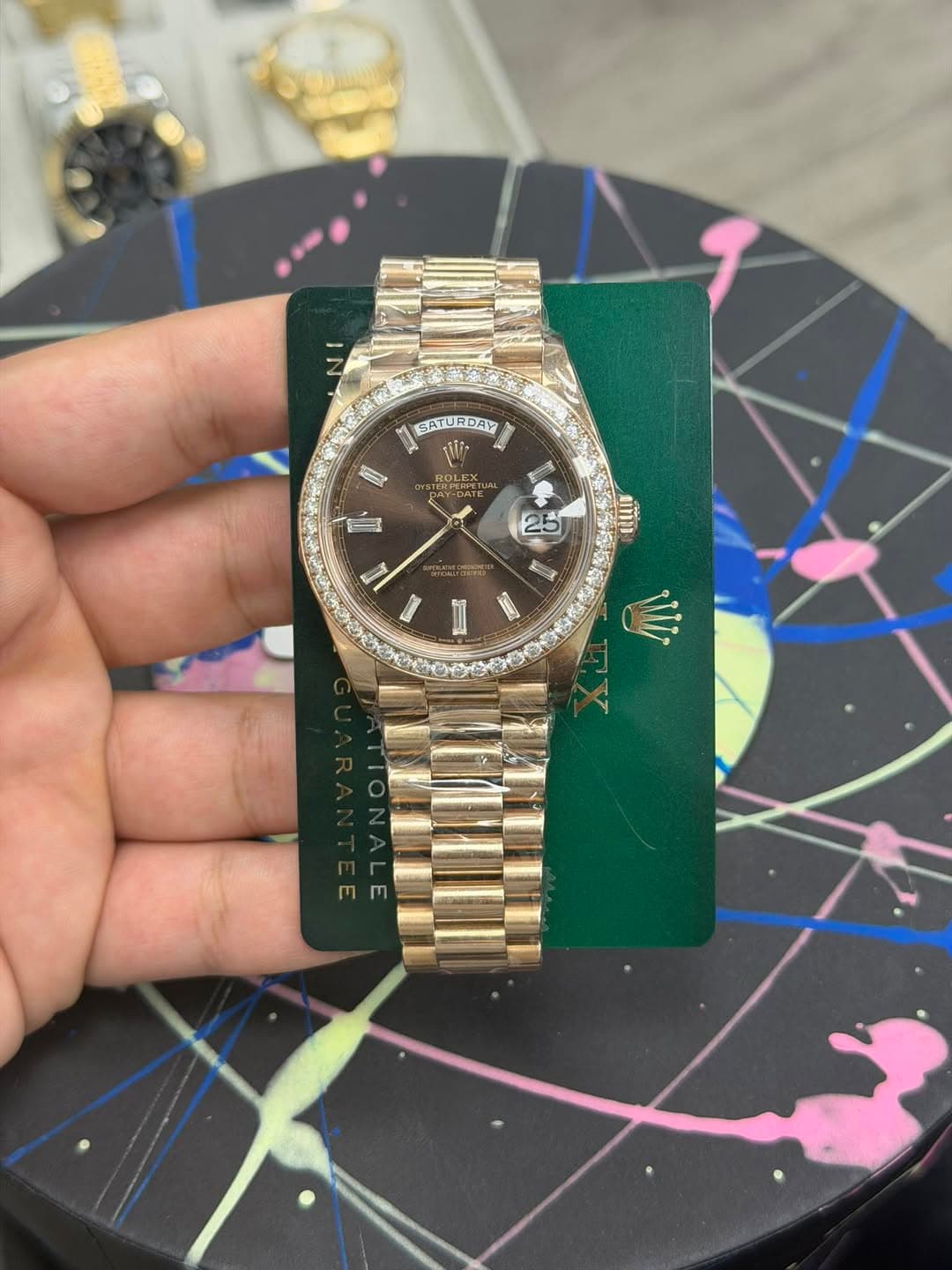 May be an image of wrist watch and text