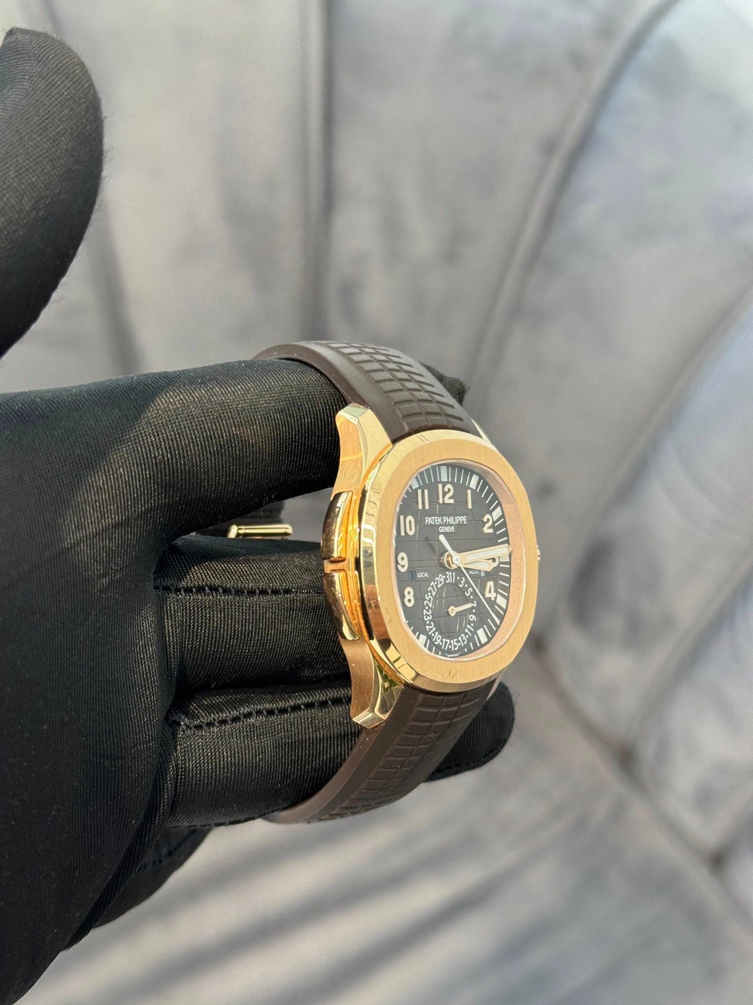 May be an image of leather, wrist watch and text