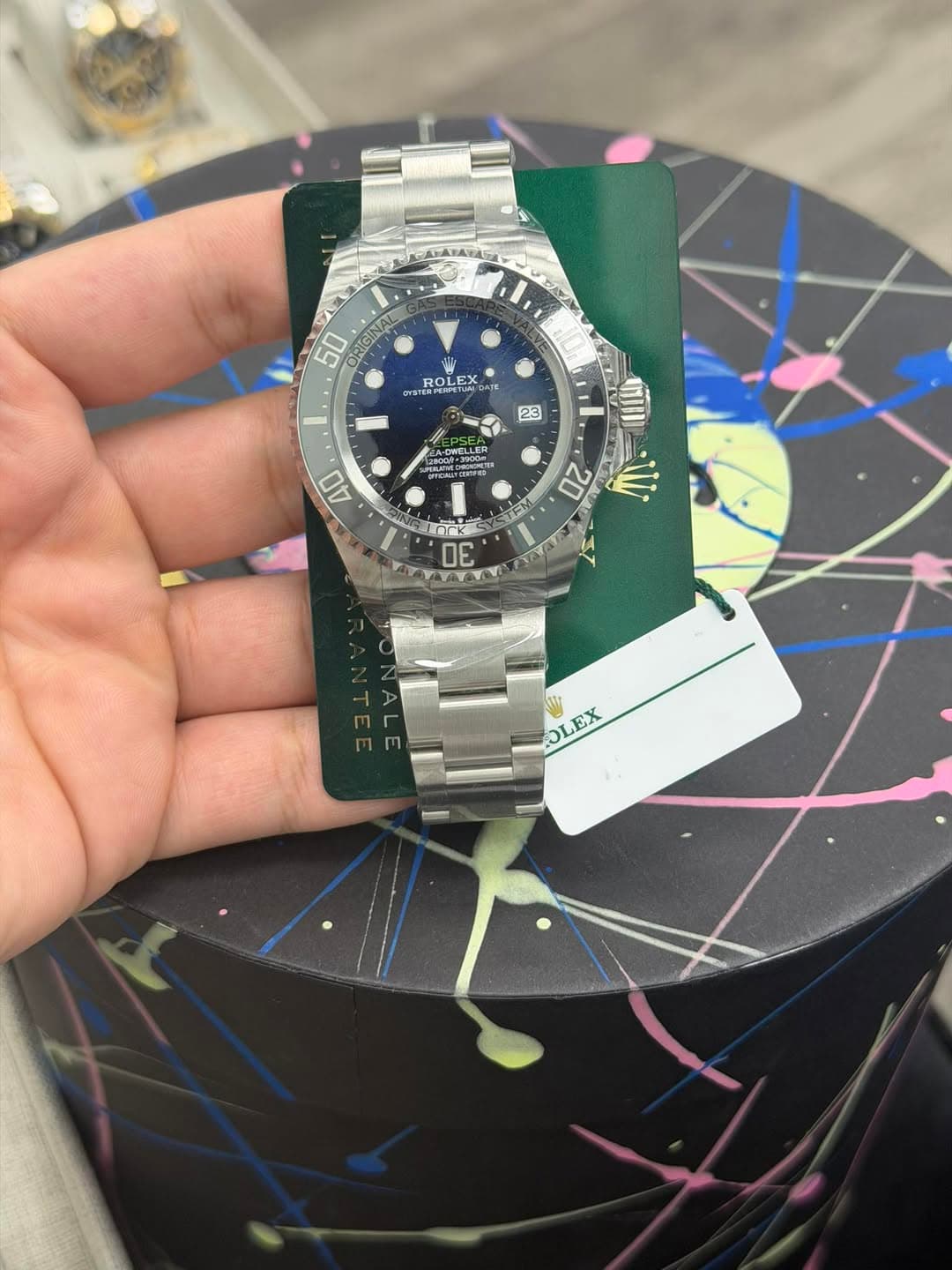 May be an image of wrist watch and text