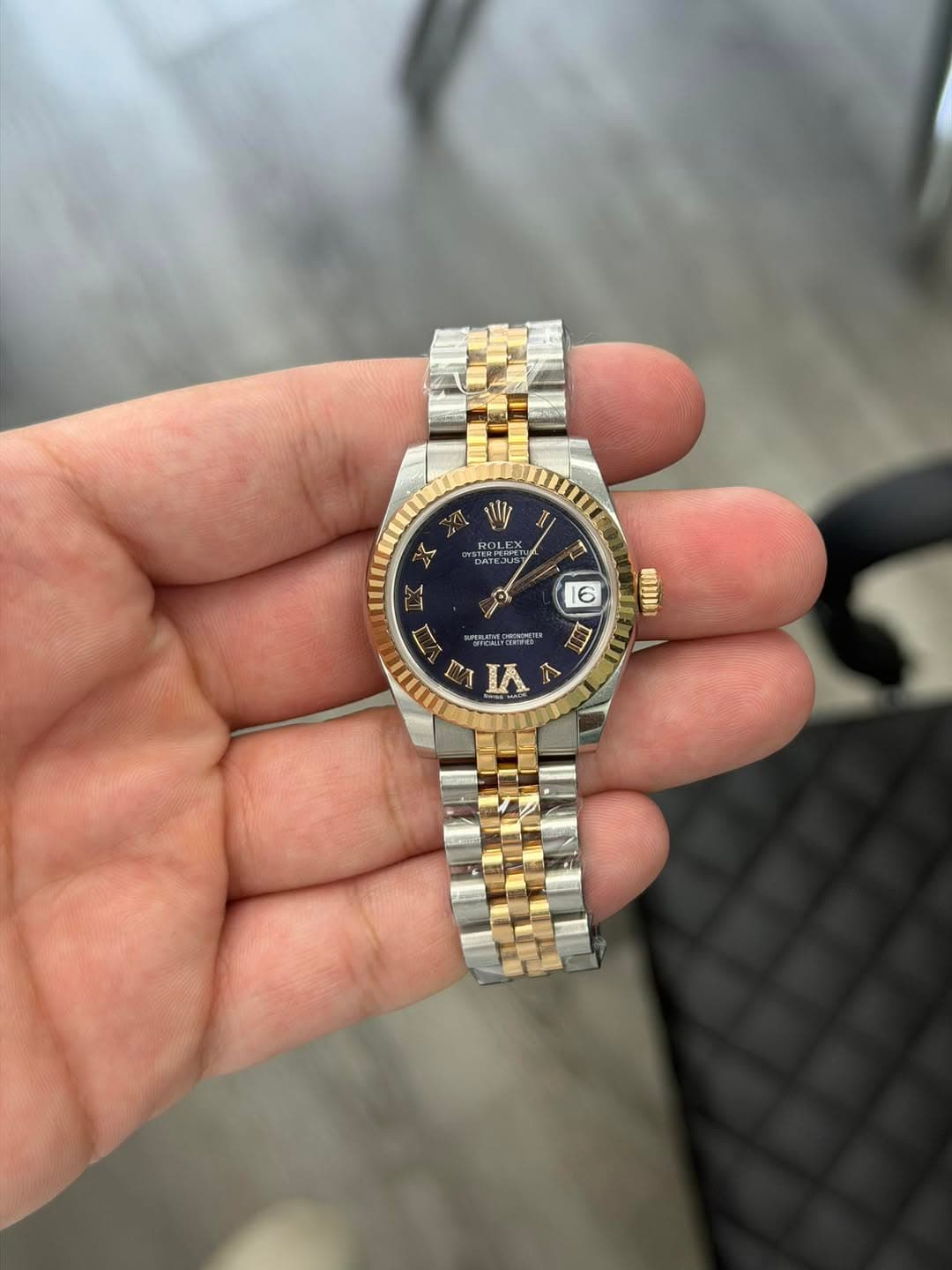 May be an image of wrist watch and text